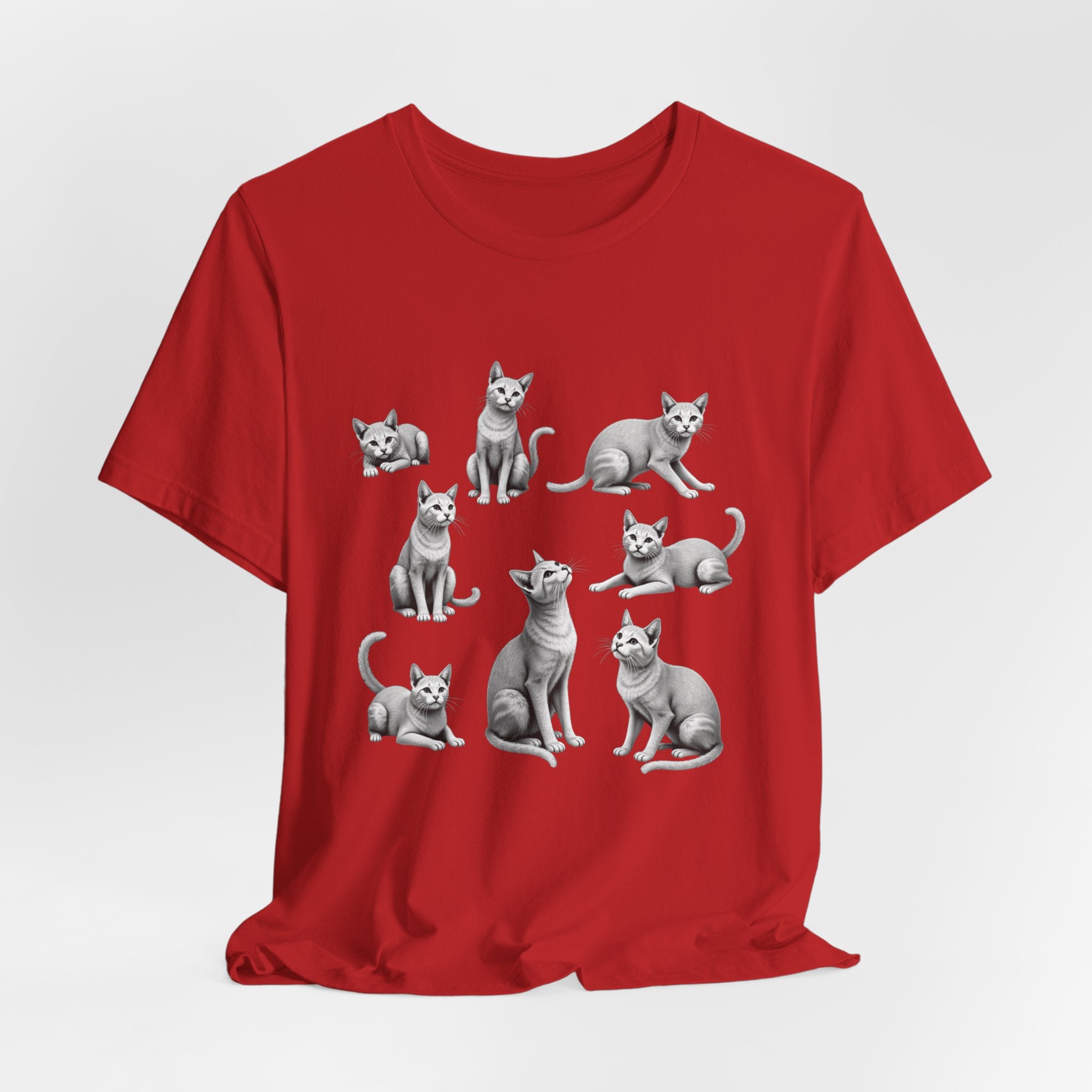 Red t-shirt with gray cat illustrations on a white background