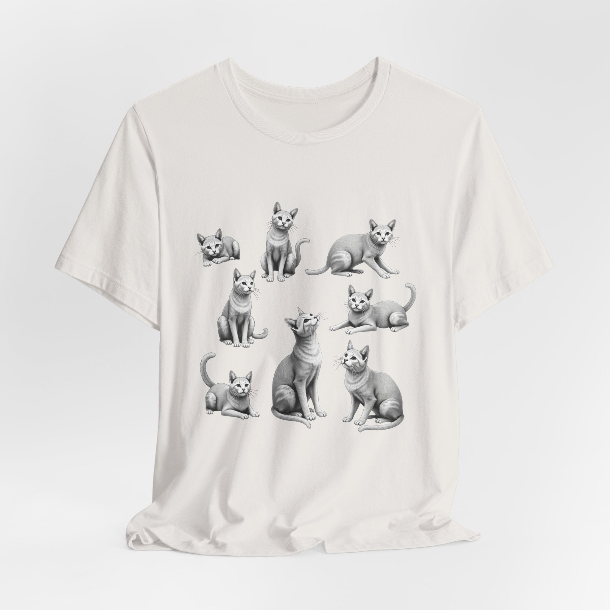 Vintage white t-shirt with black and white cat illustrations on a light gray background