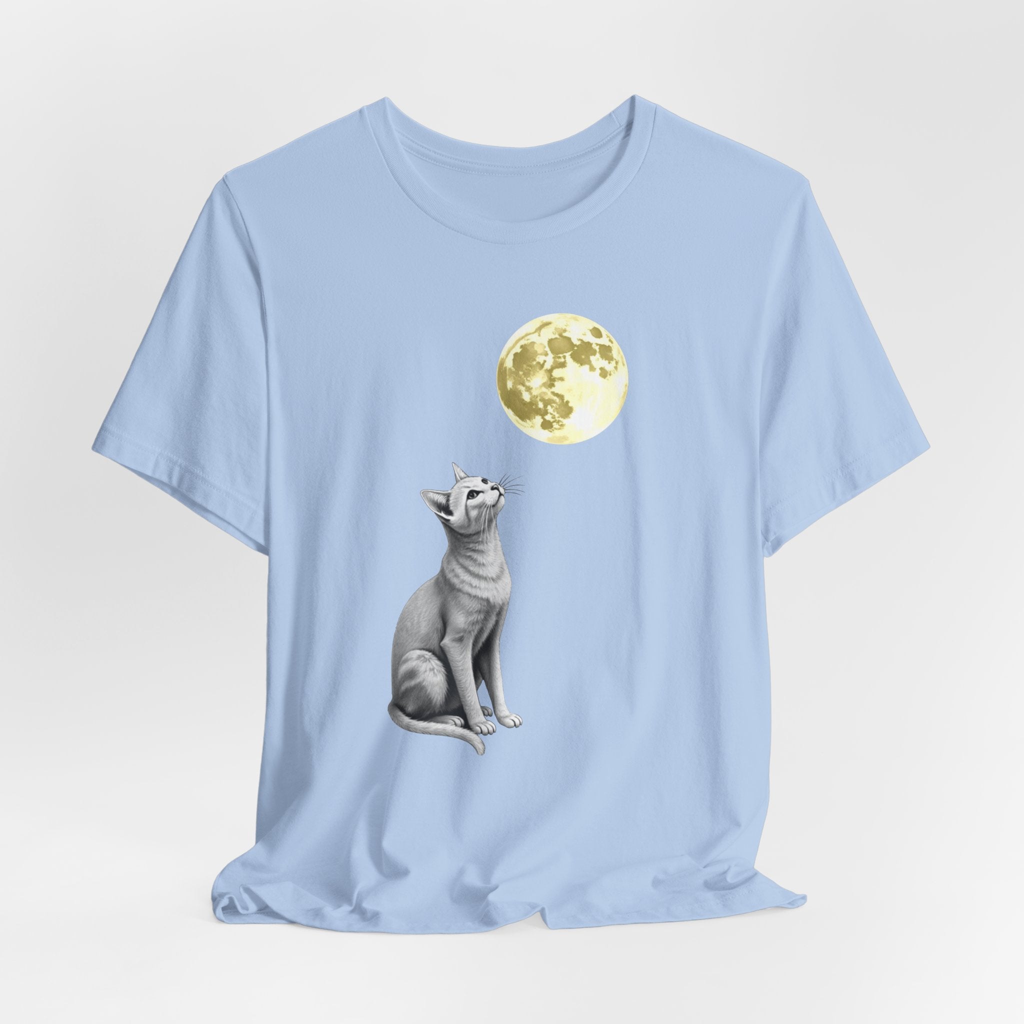 Light blue t-shirt with a graphic of a cat and a full moon on a white background