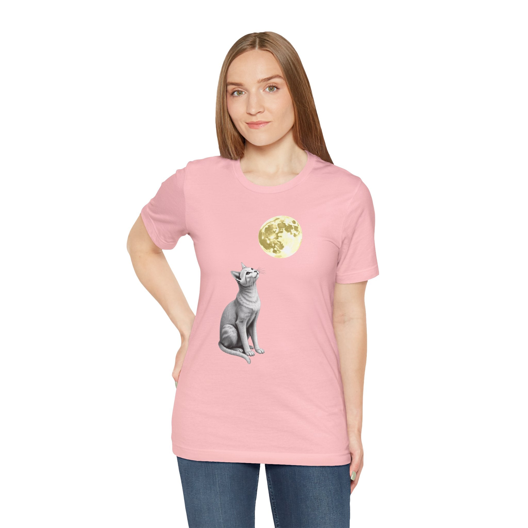 Person wearing a pink t-shirt with a cat graphic on a white background