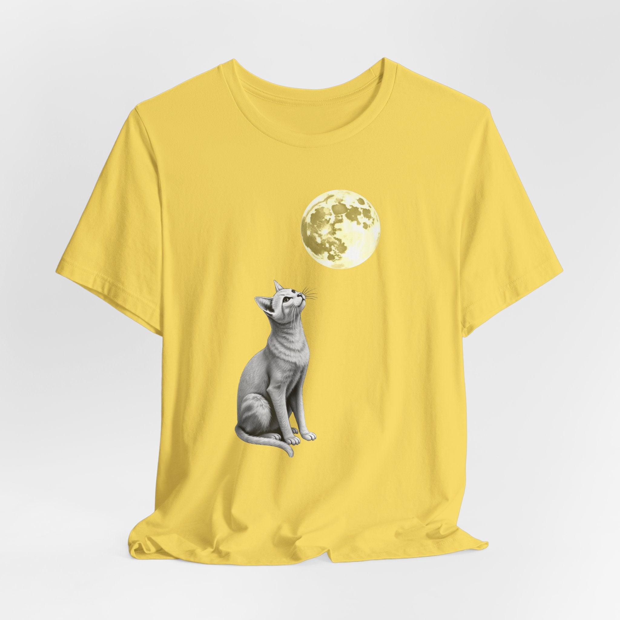Maze yellow t-shirt with a cat and moon graphic on a light gray background