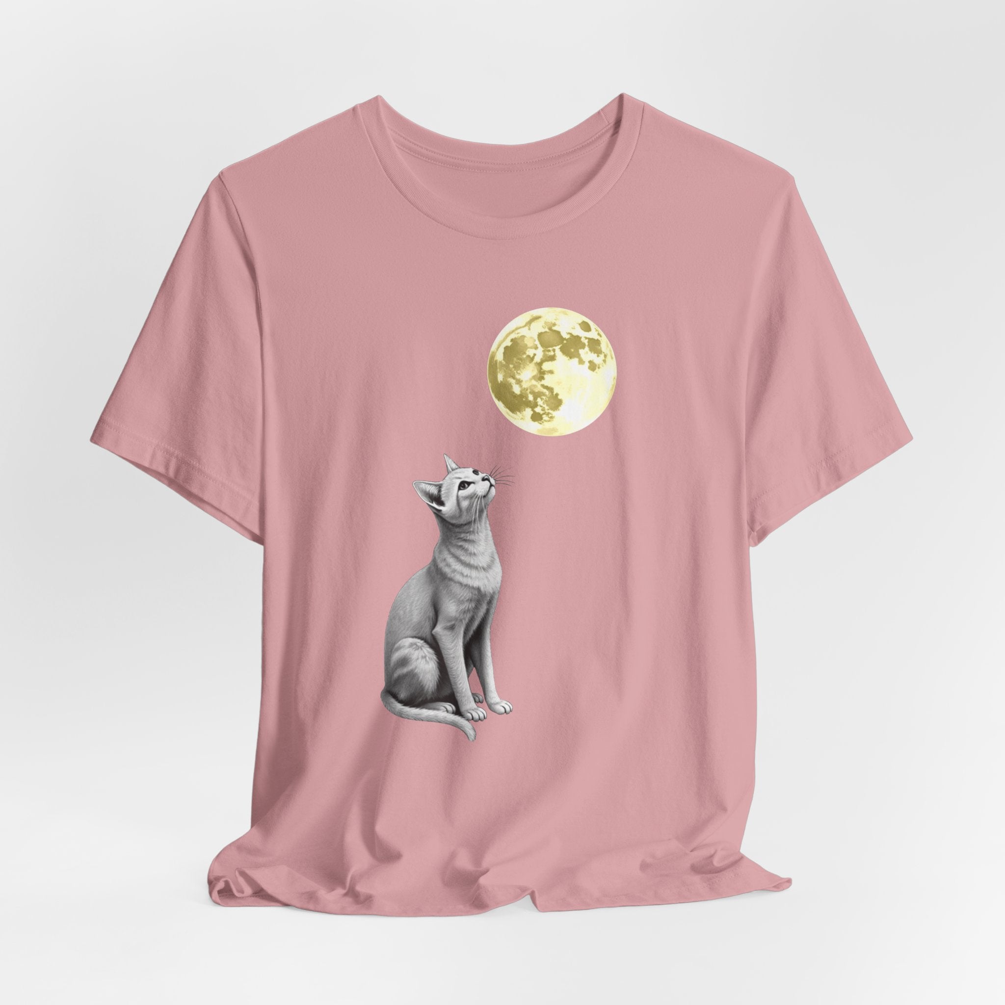 Orchid pink t-shirt with a cat and moon graphic on a light gray background