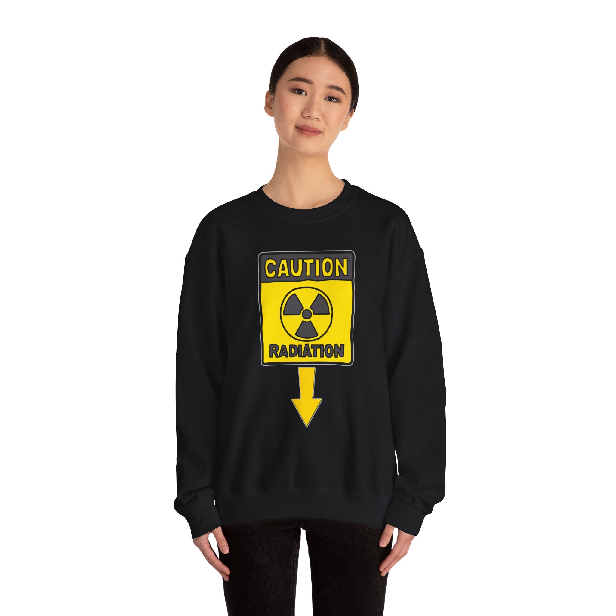 Person wearing a black sweatshirt with a radiation warning sign design on a white background