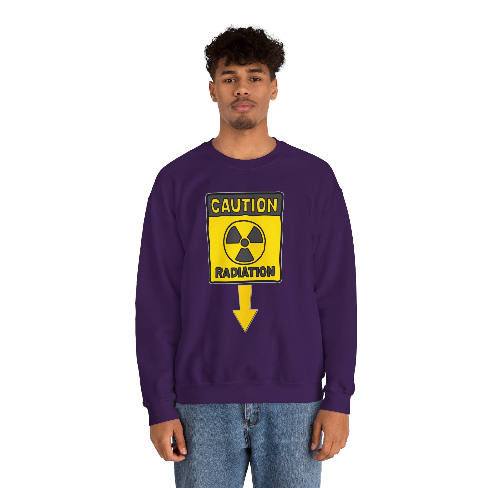 Person wearing a purple sweatshirt with a radiation warning sign design on a white background