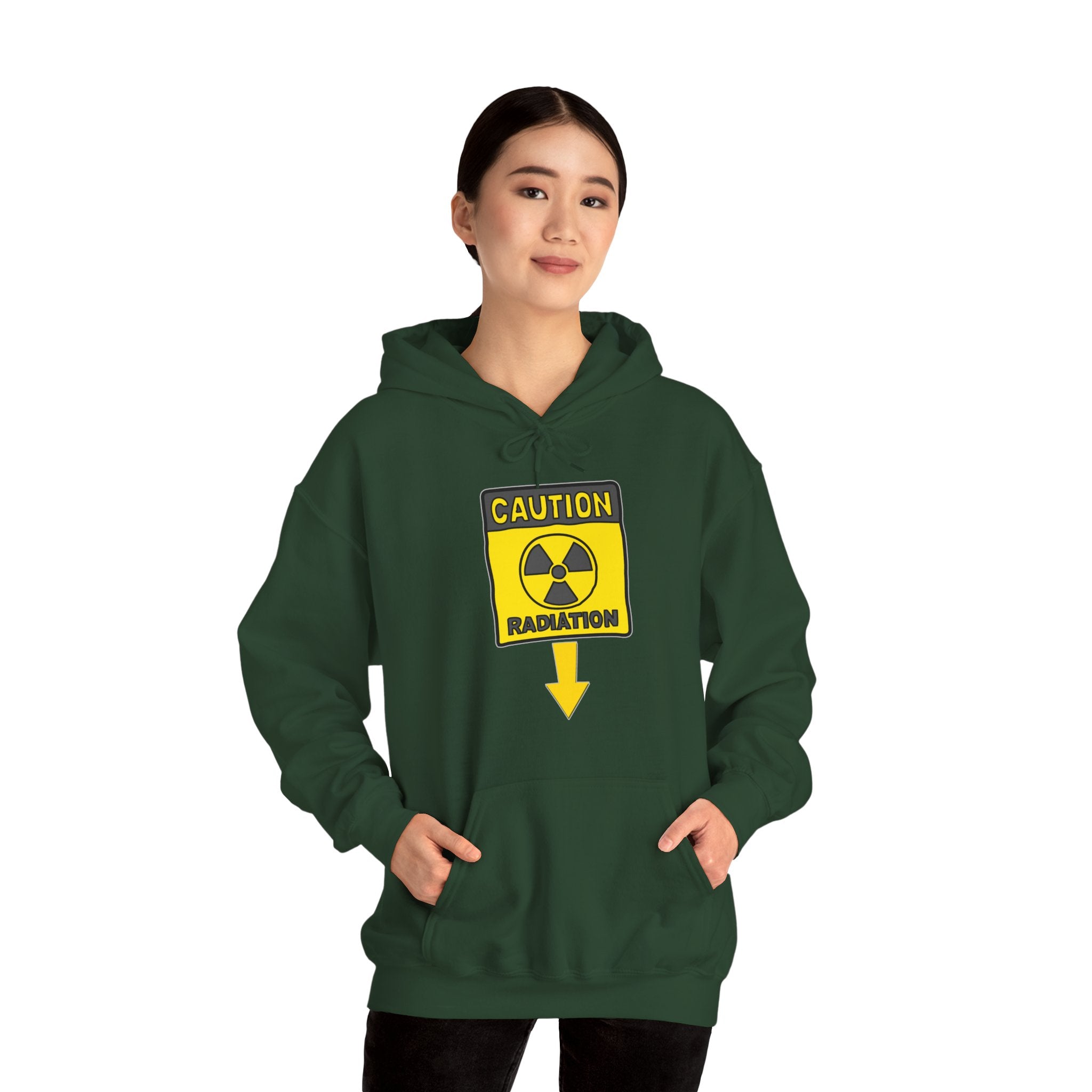 Person wearing a green hoodie with a radiation warning sign on a white background