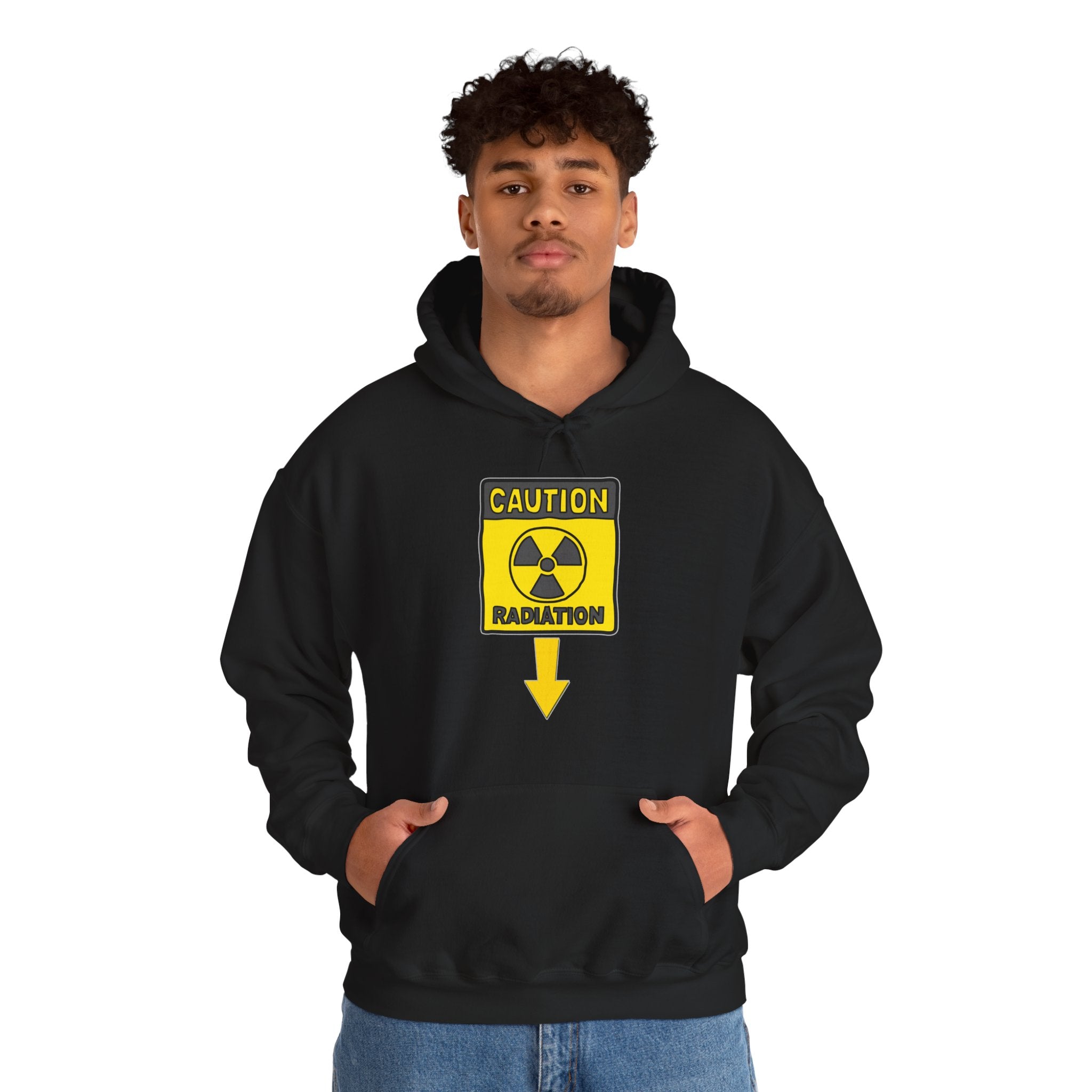 Person wearing a black hoodie with a radiation warning symbol on a white background