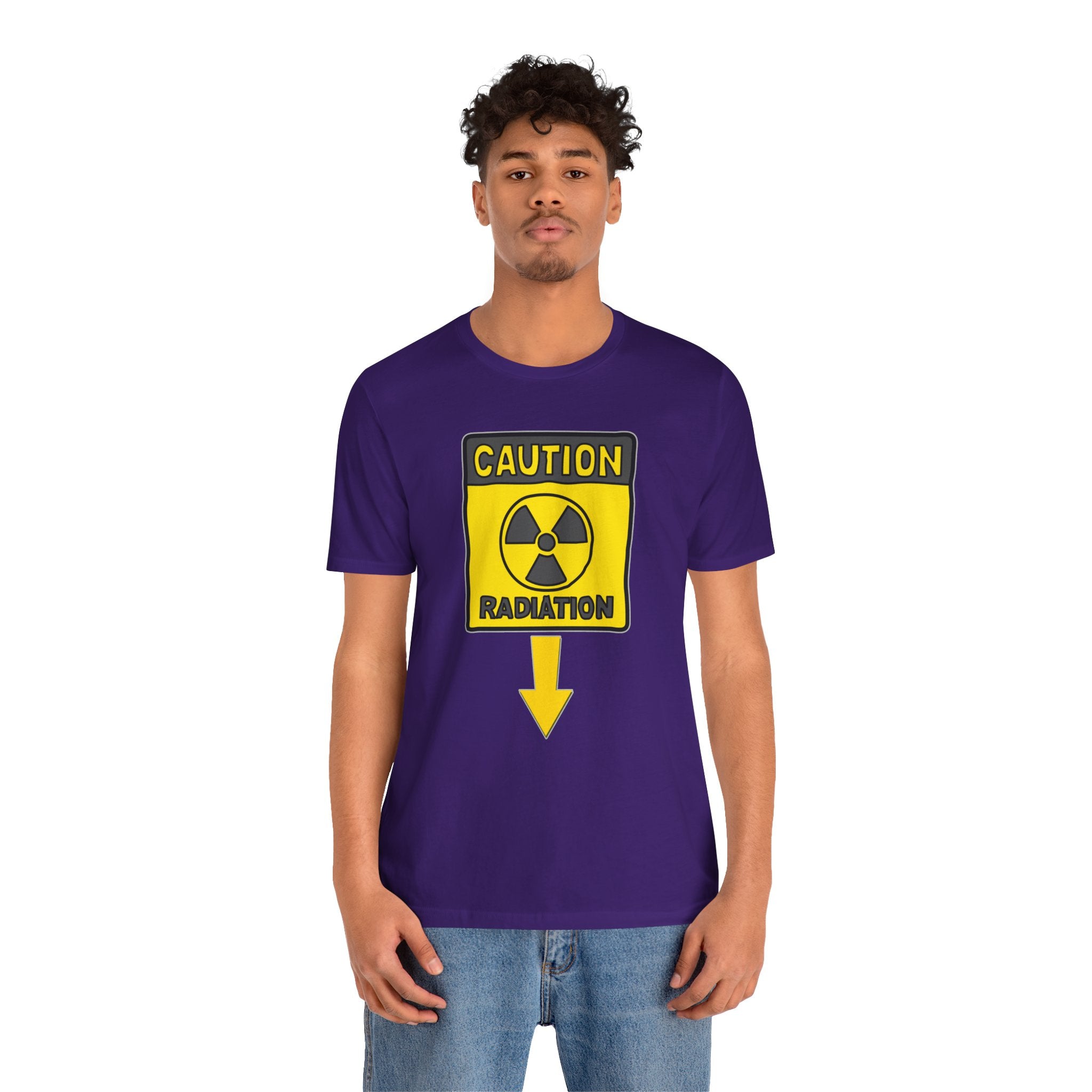 Person wearing a purple t-shirt with a radiation warning sign graphic on a white background
