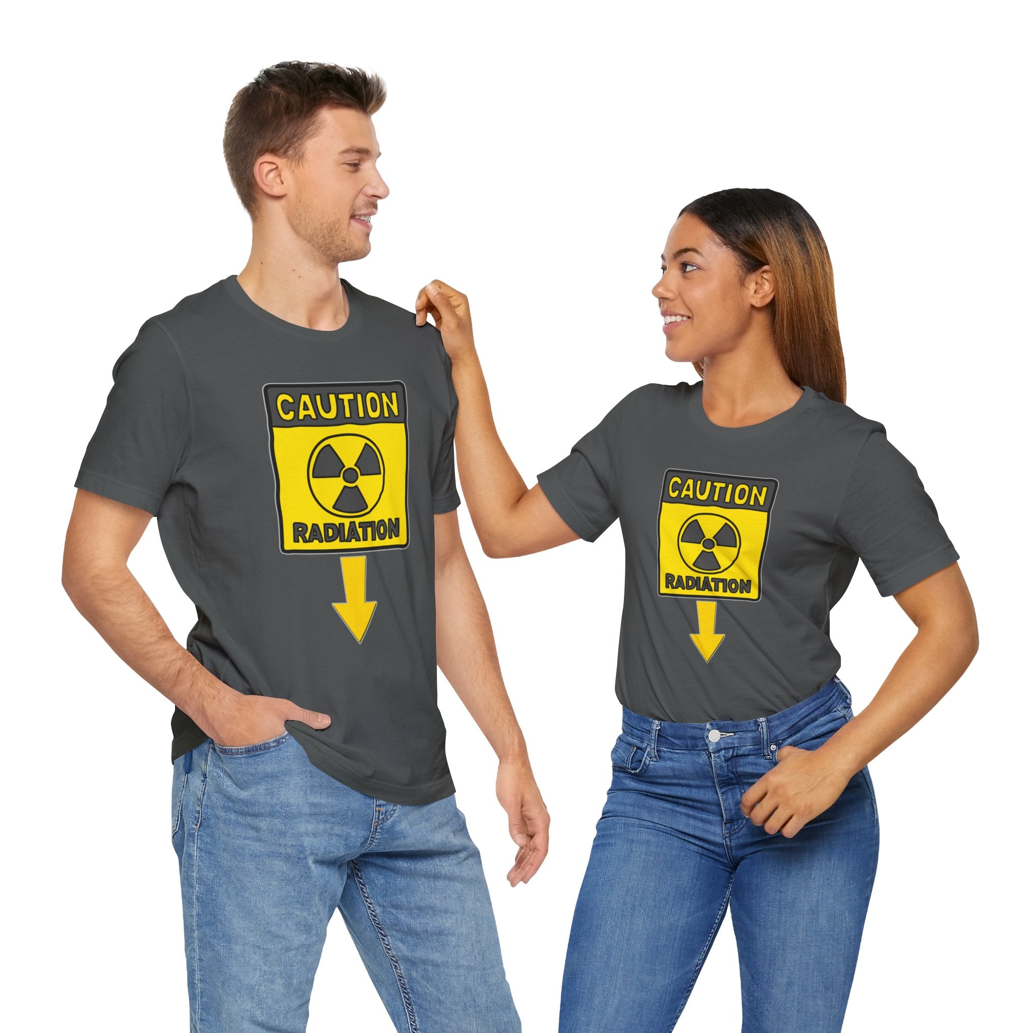 Two people wearing gray t-shirts with a radiation warning symbol.
