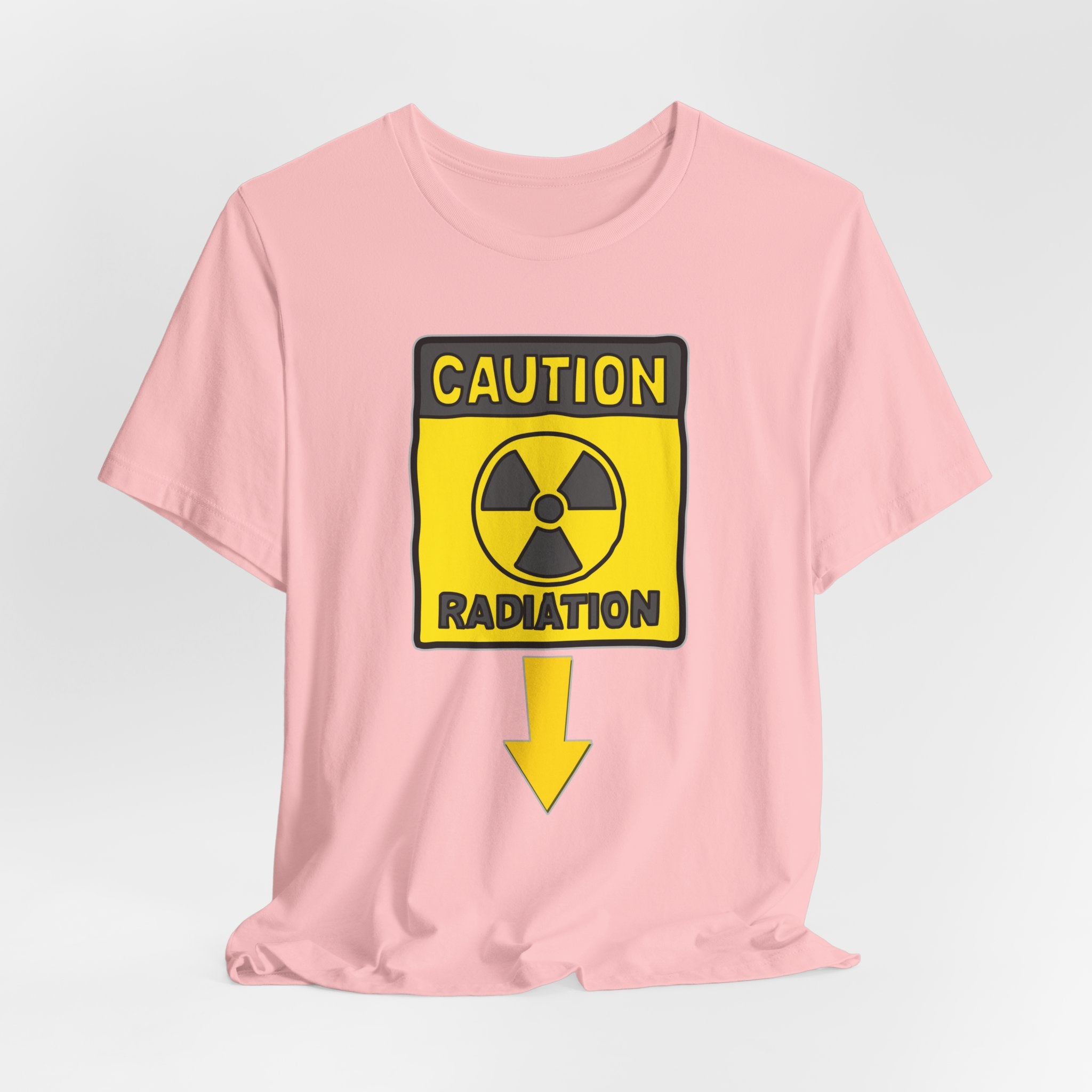 Pink t-shirt with a radiation warning sign graphic on a light gray background