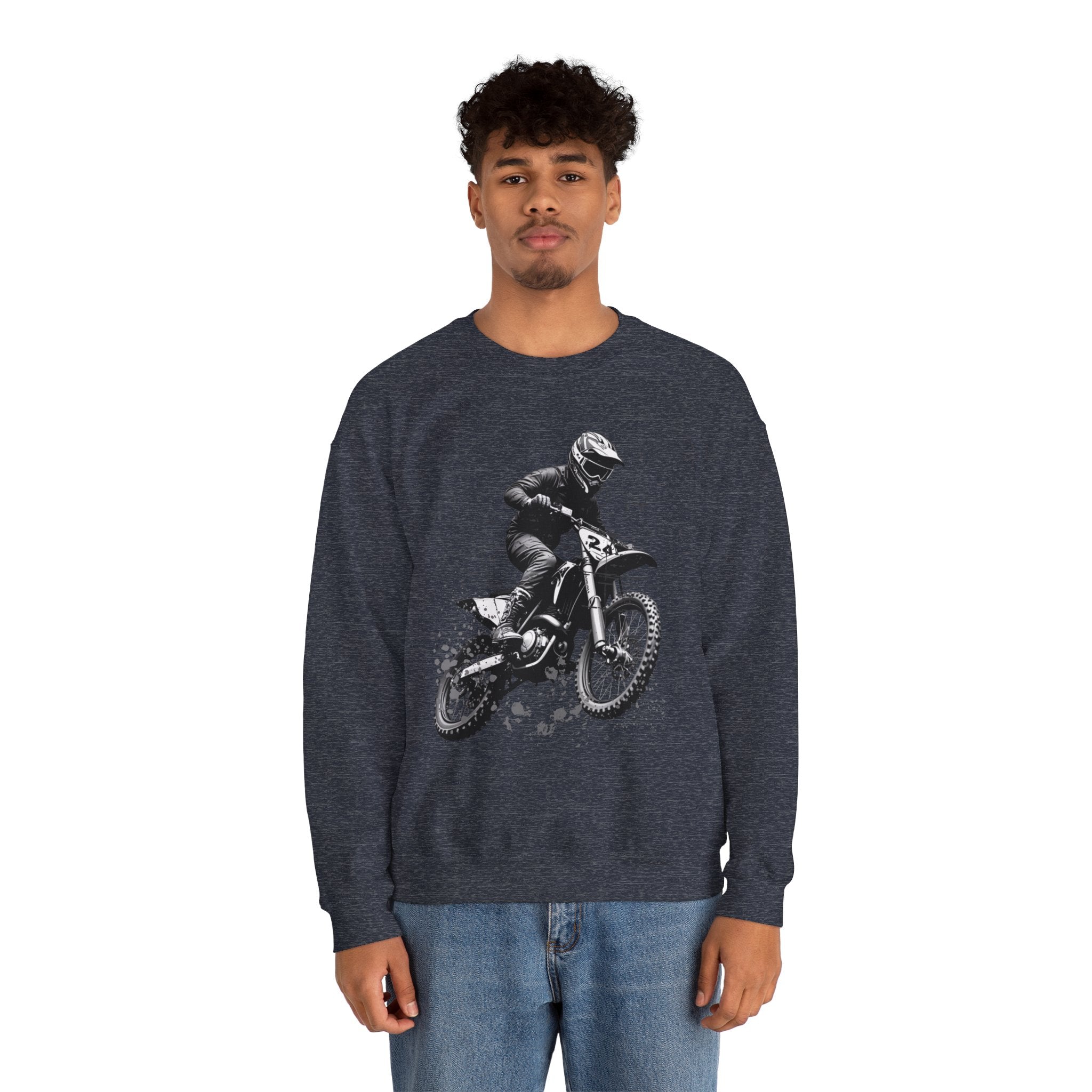 Person wearing a dark blue sweatshirt with a graphic of a person on a bike, standing against a white background.