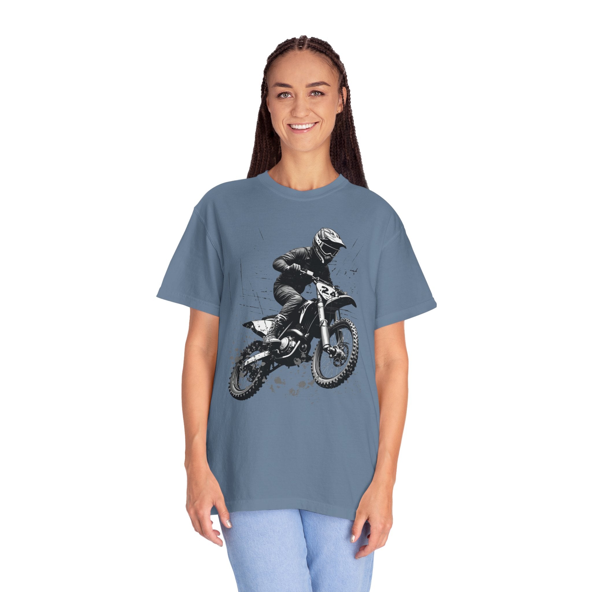 Person wearing a blue t-shirt with a graphic of a person on a motorcycle