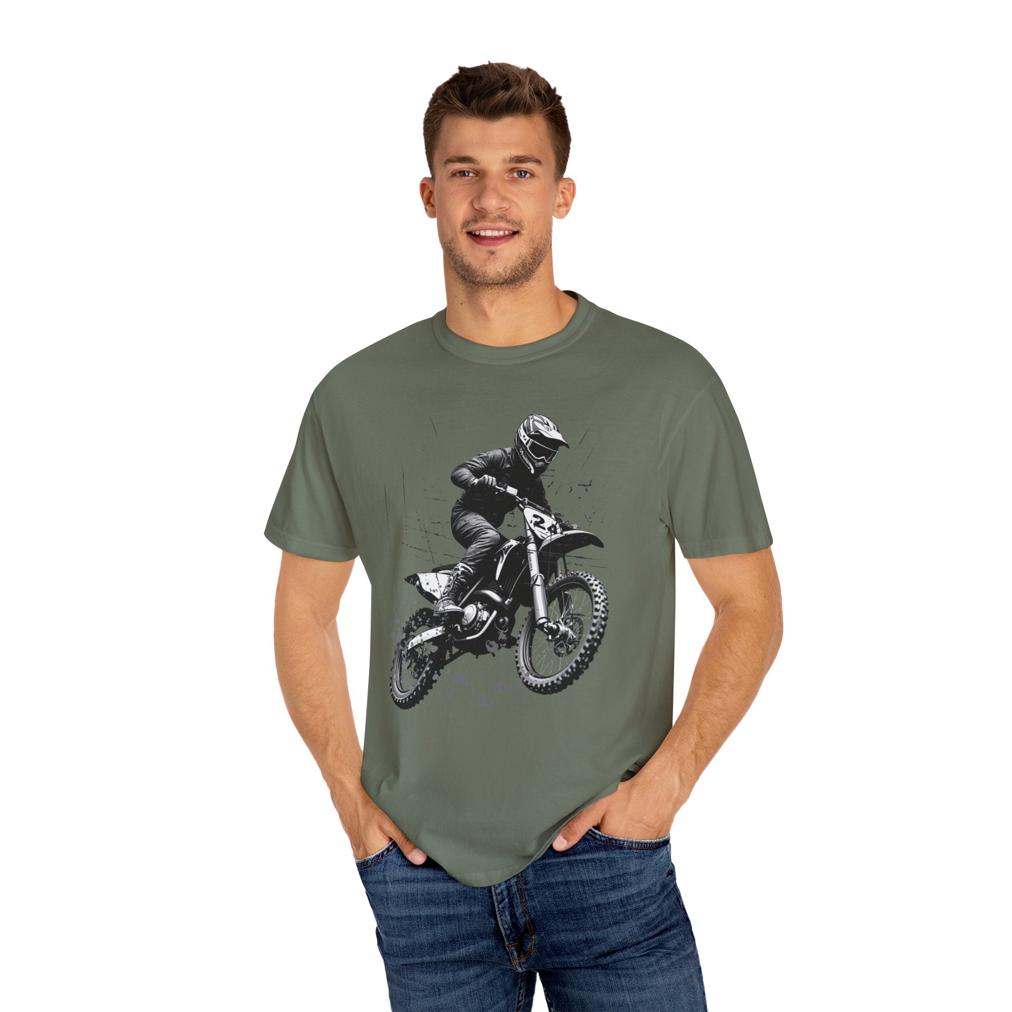 Man wearing a green t-shirt with a graphic of a person on a motorcycle