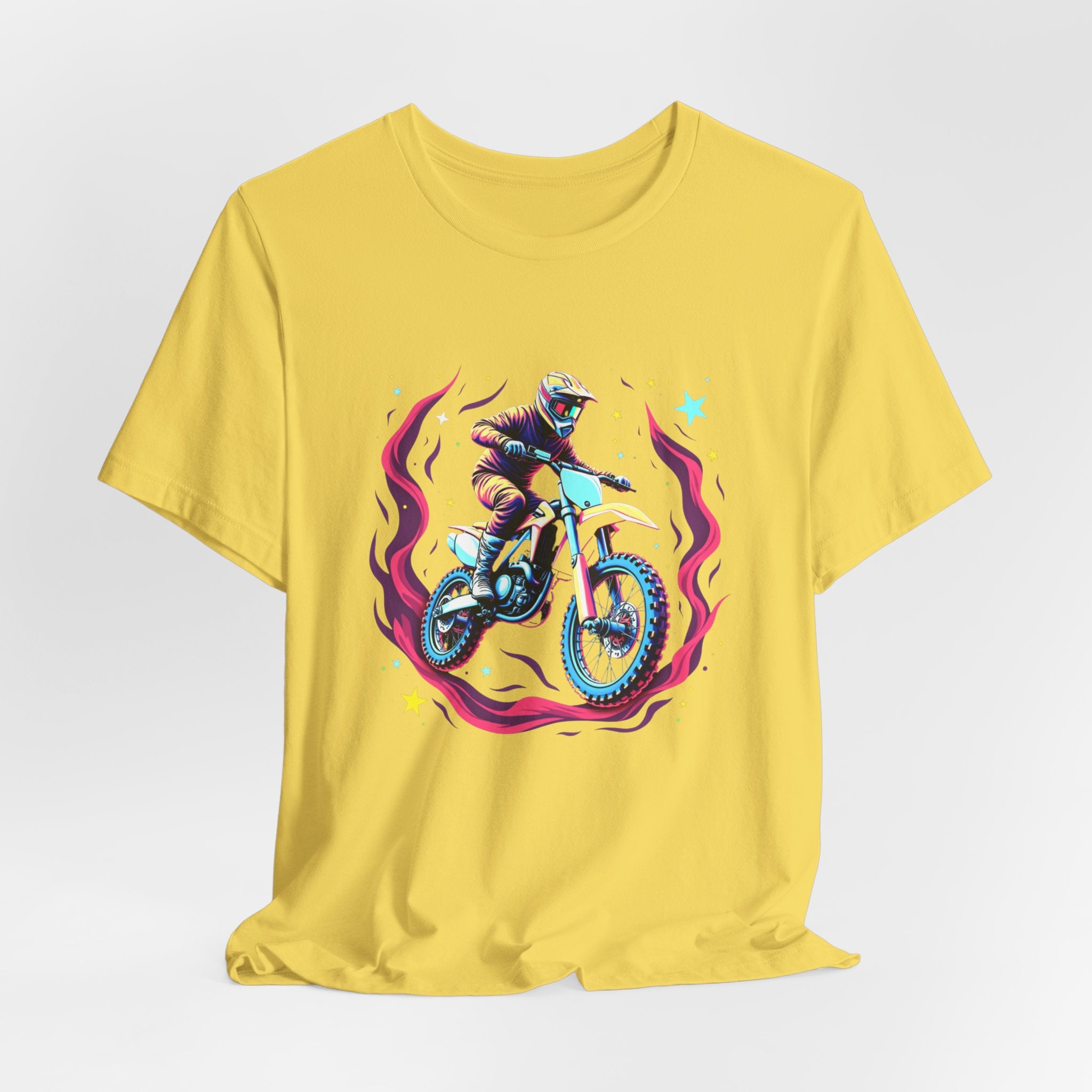 Yellow t-shirt with a graphic of a person on a motorcycle and cosmic flames & stars on a white background