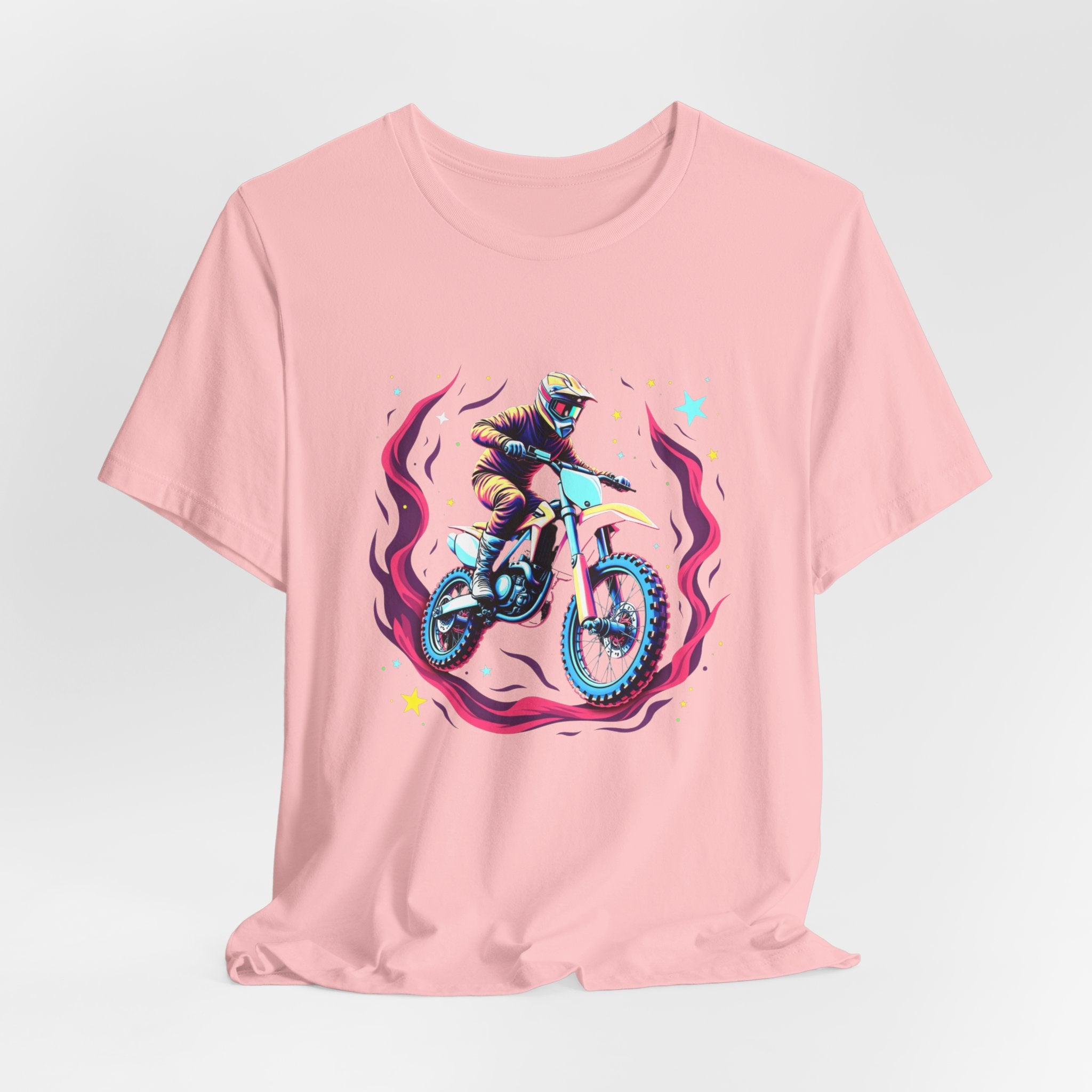 Pink t-shirt with a graphic of a person on a motorcycle and cosmic flames & stars on a white background