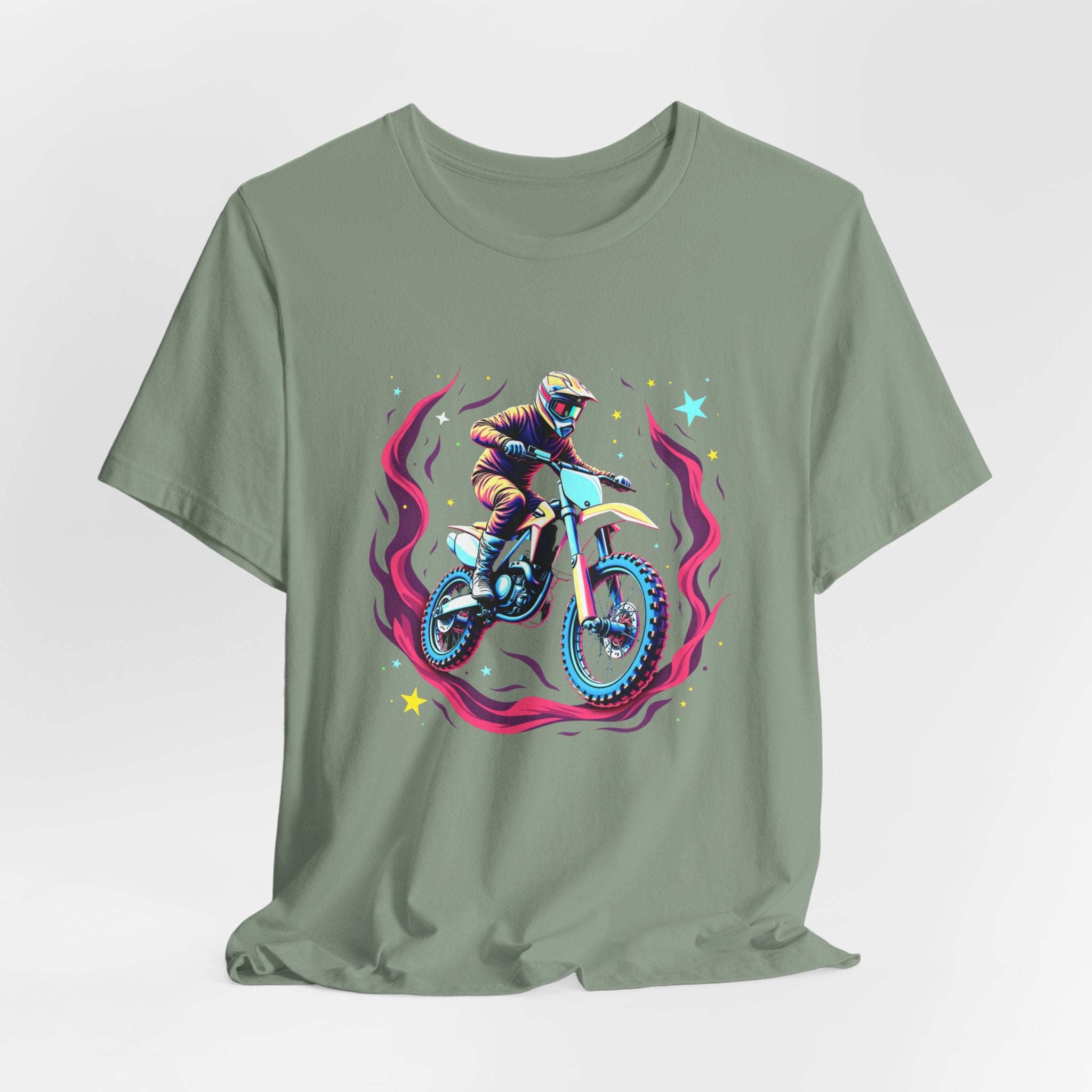 Sage green t-shirt with a graphic of a person on a motorcycle and cosmic flames & stars on a white background