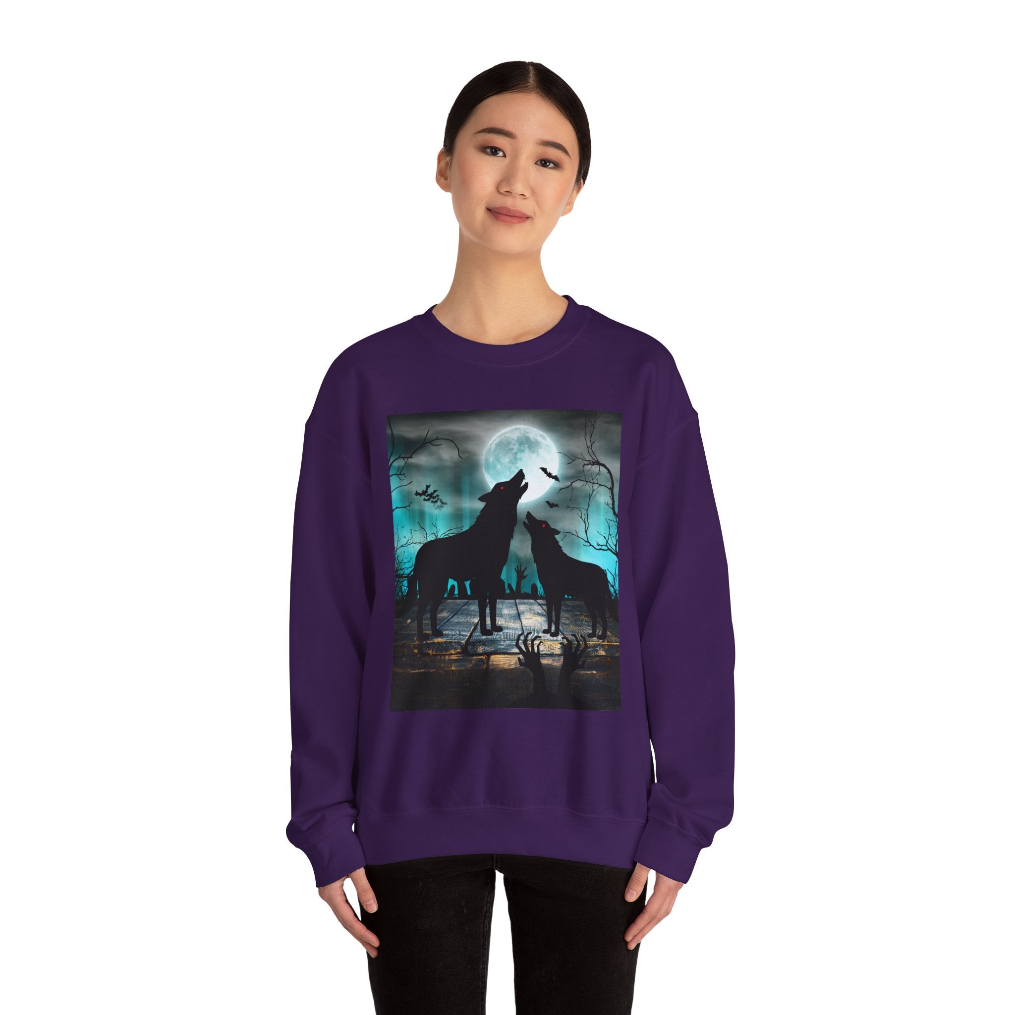 Person wearing a purple sweatshirt with a graphic of two wolves howling at a moonlit sky.