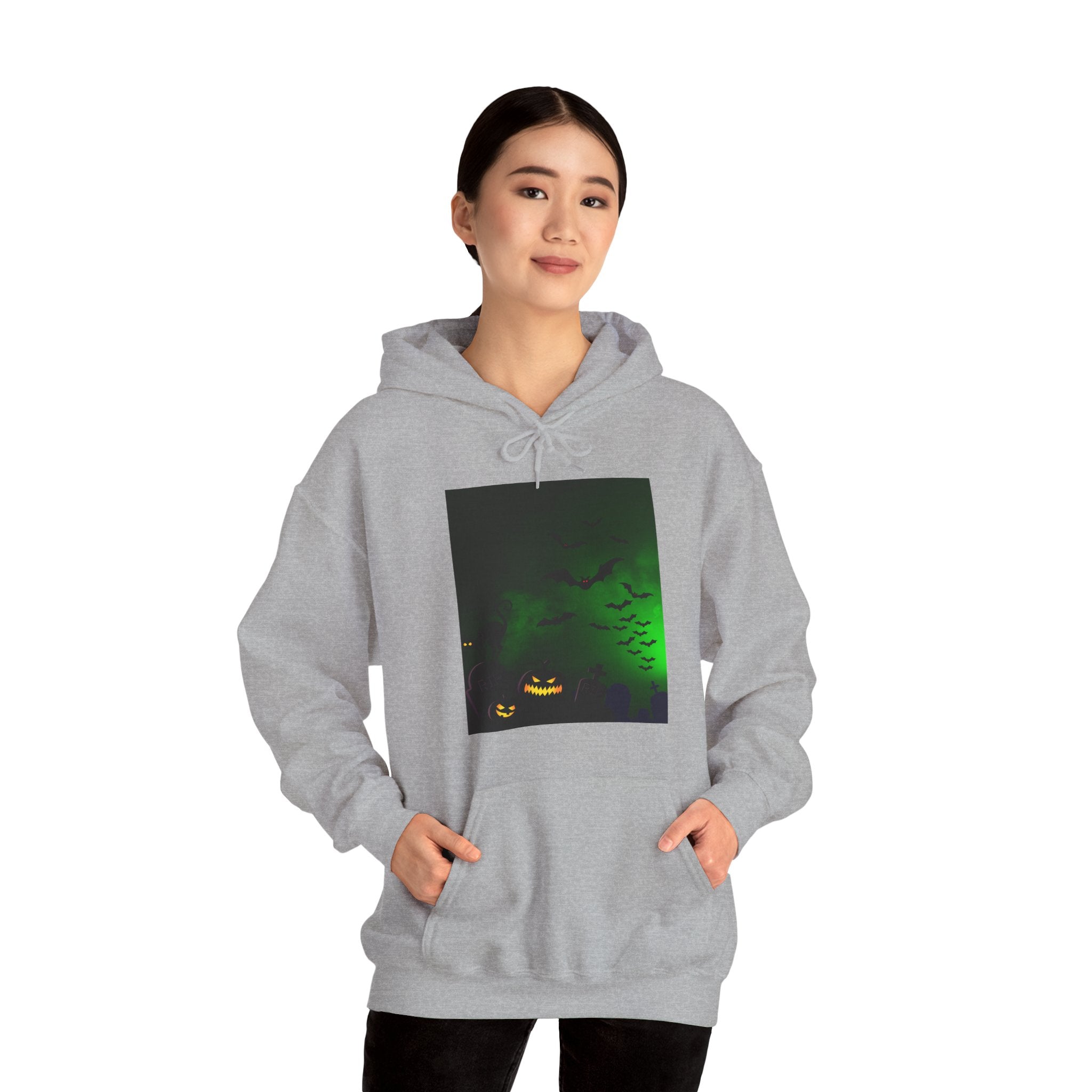 Person wearing a gray hoodie with a graphic design on a white background