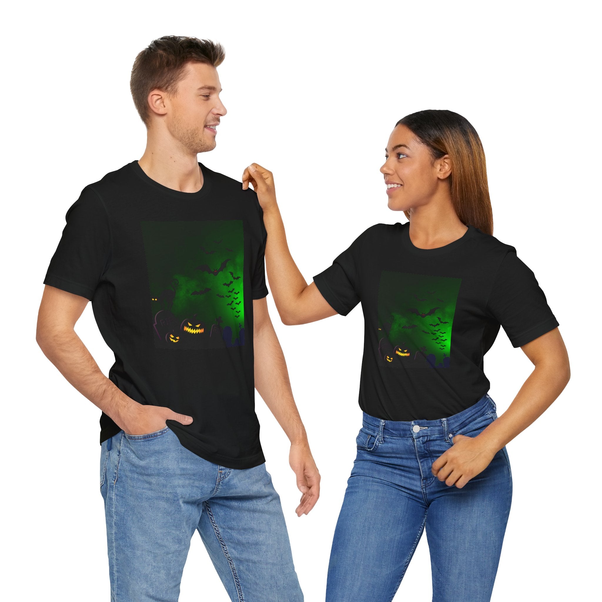 Two people wearing black t-shirts with a green graphic design on a white background