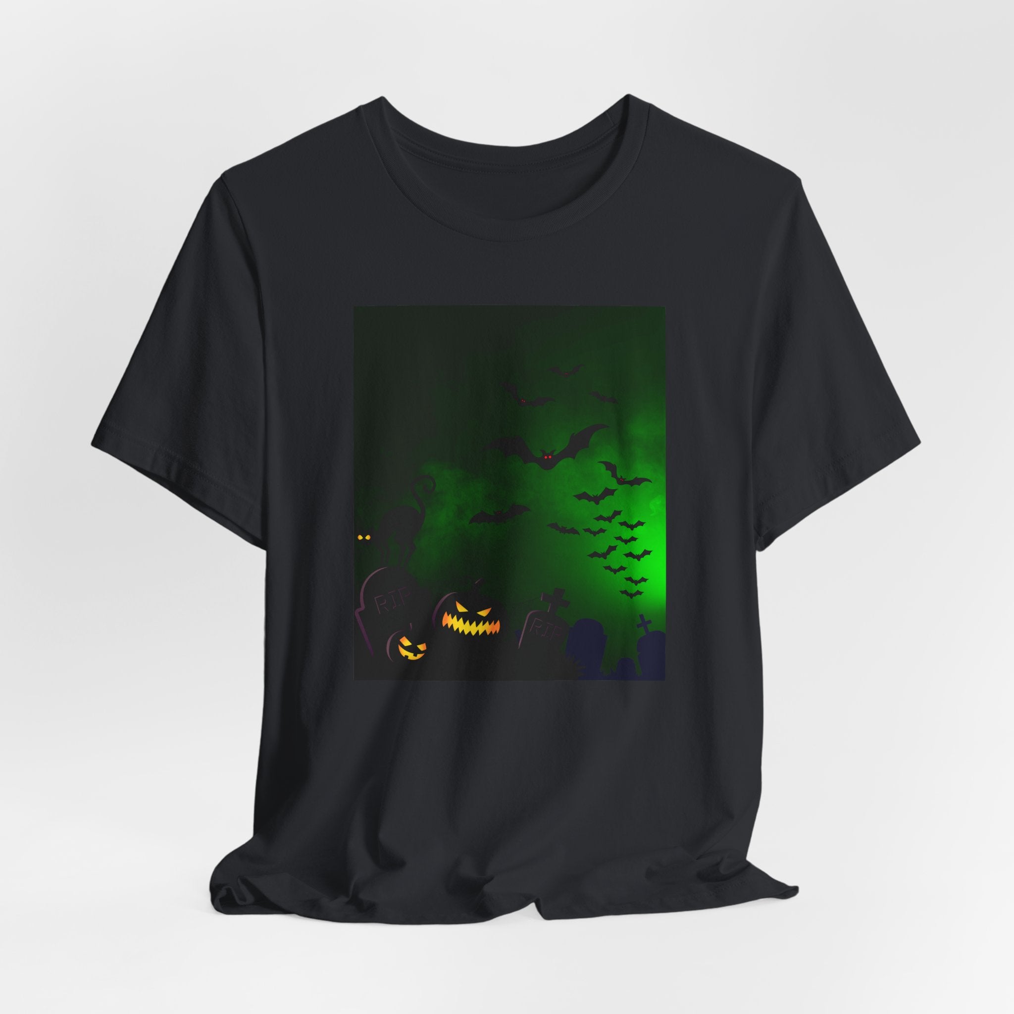 Vintage black t-shirt with Halloween-themed design featuring a pumpkin and bats on a green glow background.