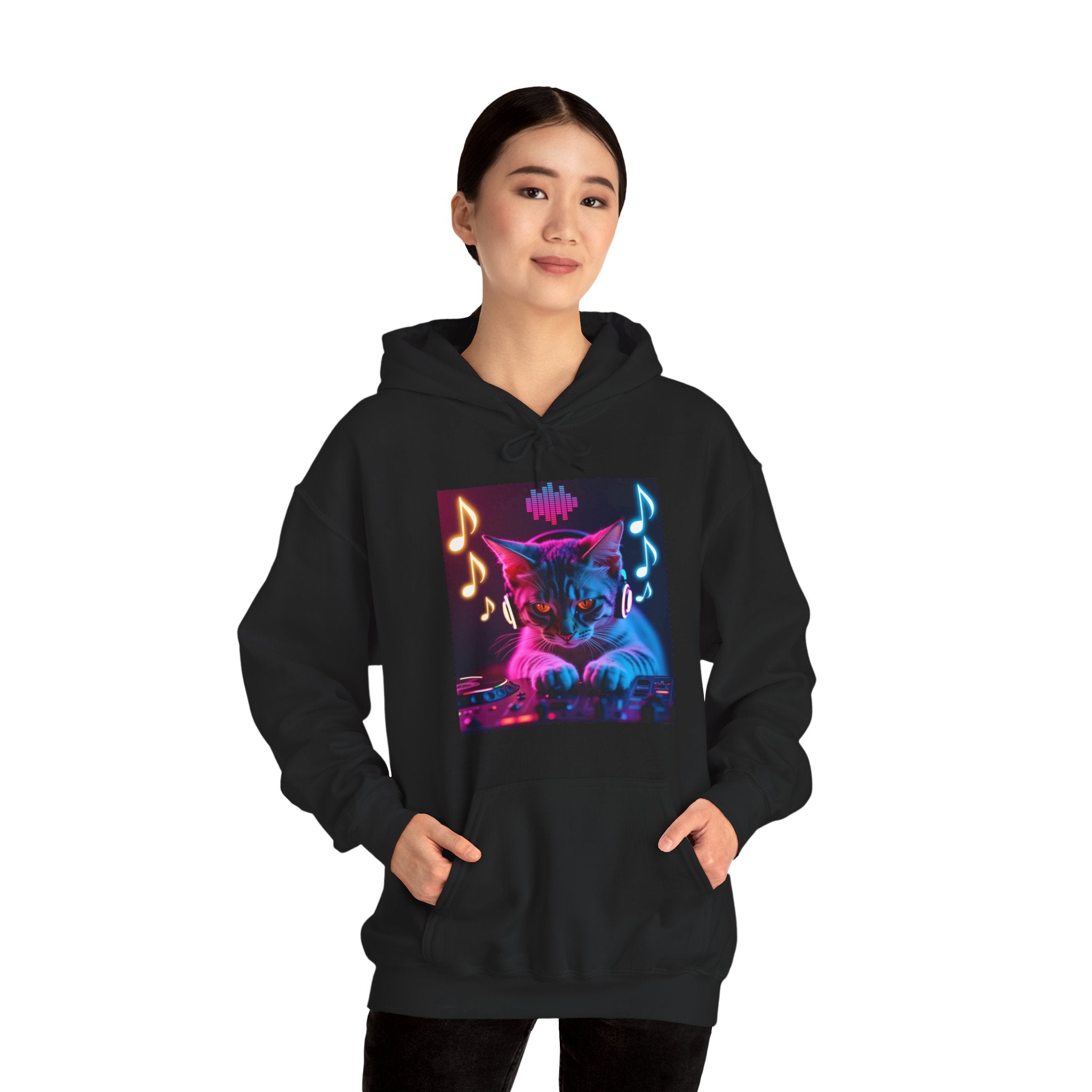 Person wearing a black hoodie with a colorful cat and music notes design on a white background