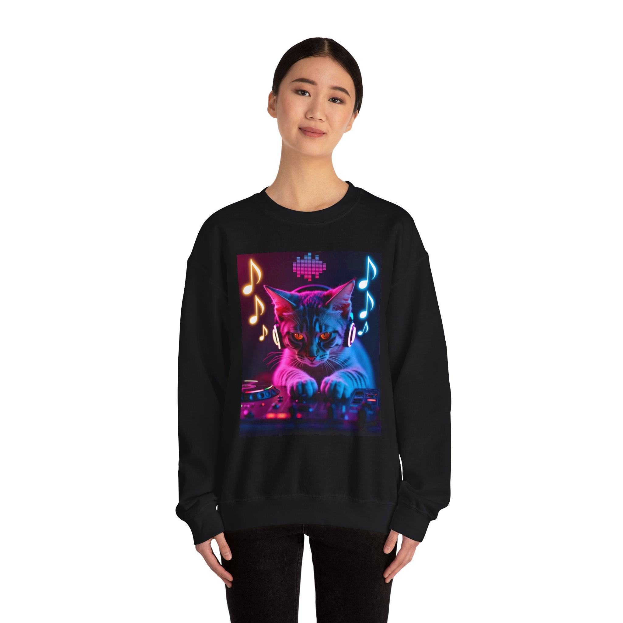 Person wearing a black sweatshirt with a colorful cat graphic and musical notes on a white background