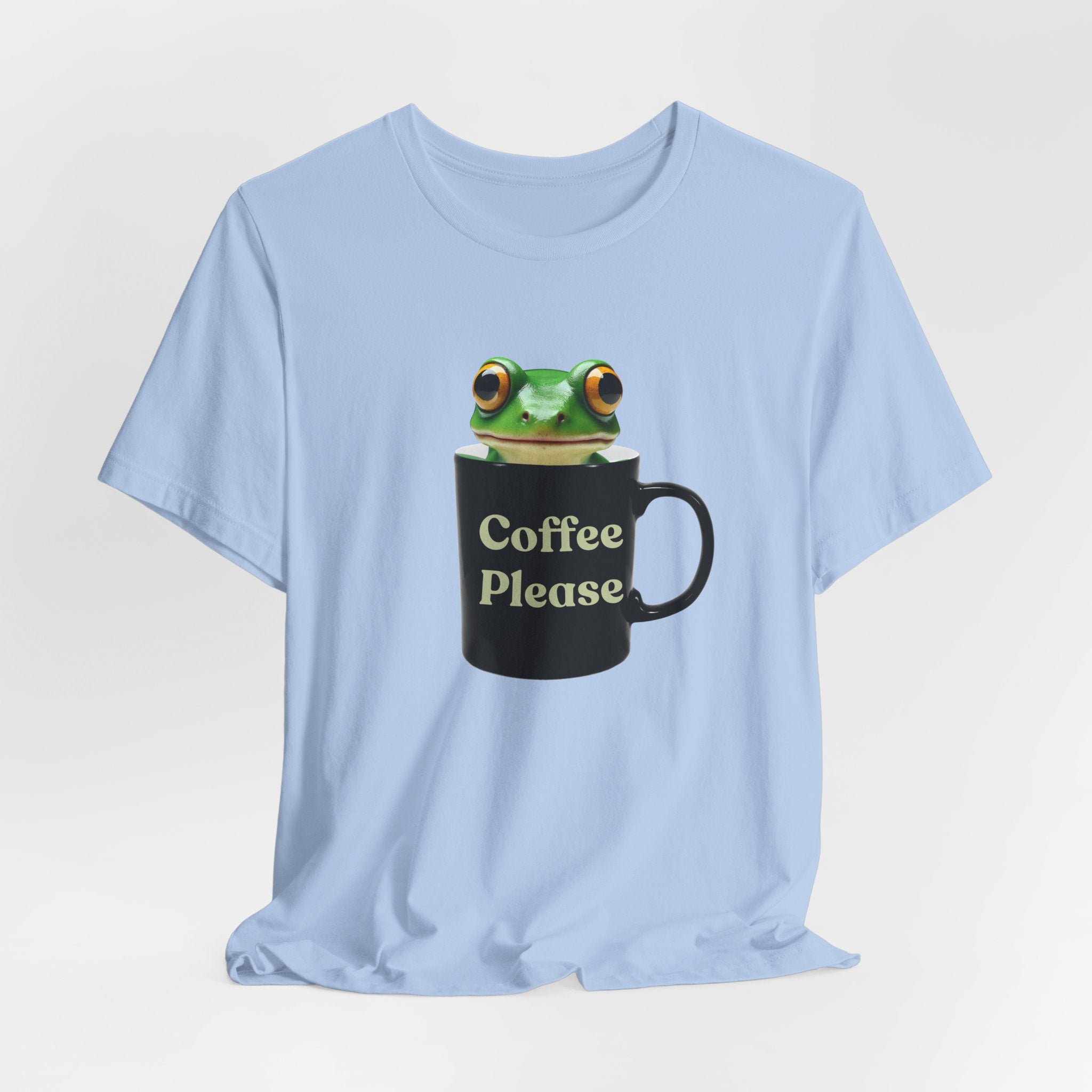 Light blue t-shirt with a frog design holding a mug labeled 'Coffee Please' on a light gray background