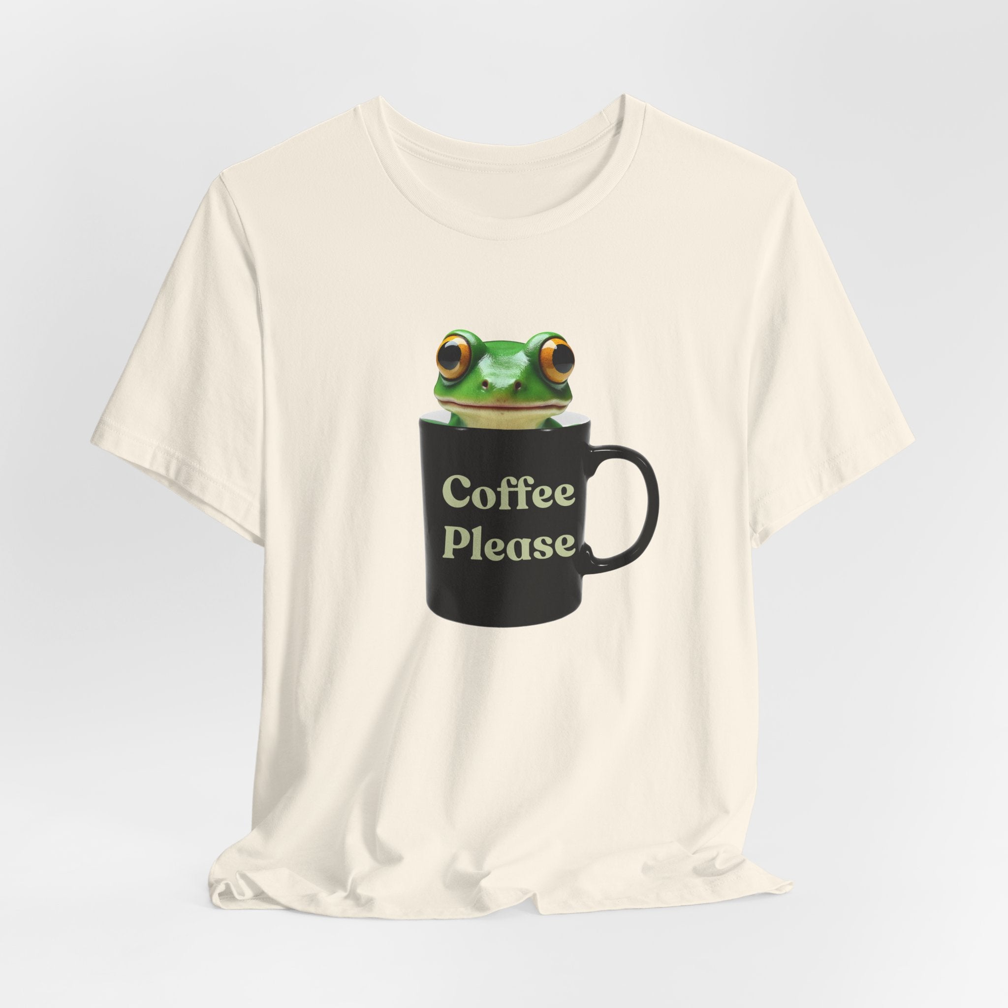 Natural white t-shirt with a frog holding a mug labeled 'Coffee Please' on a light gray background