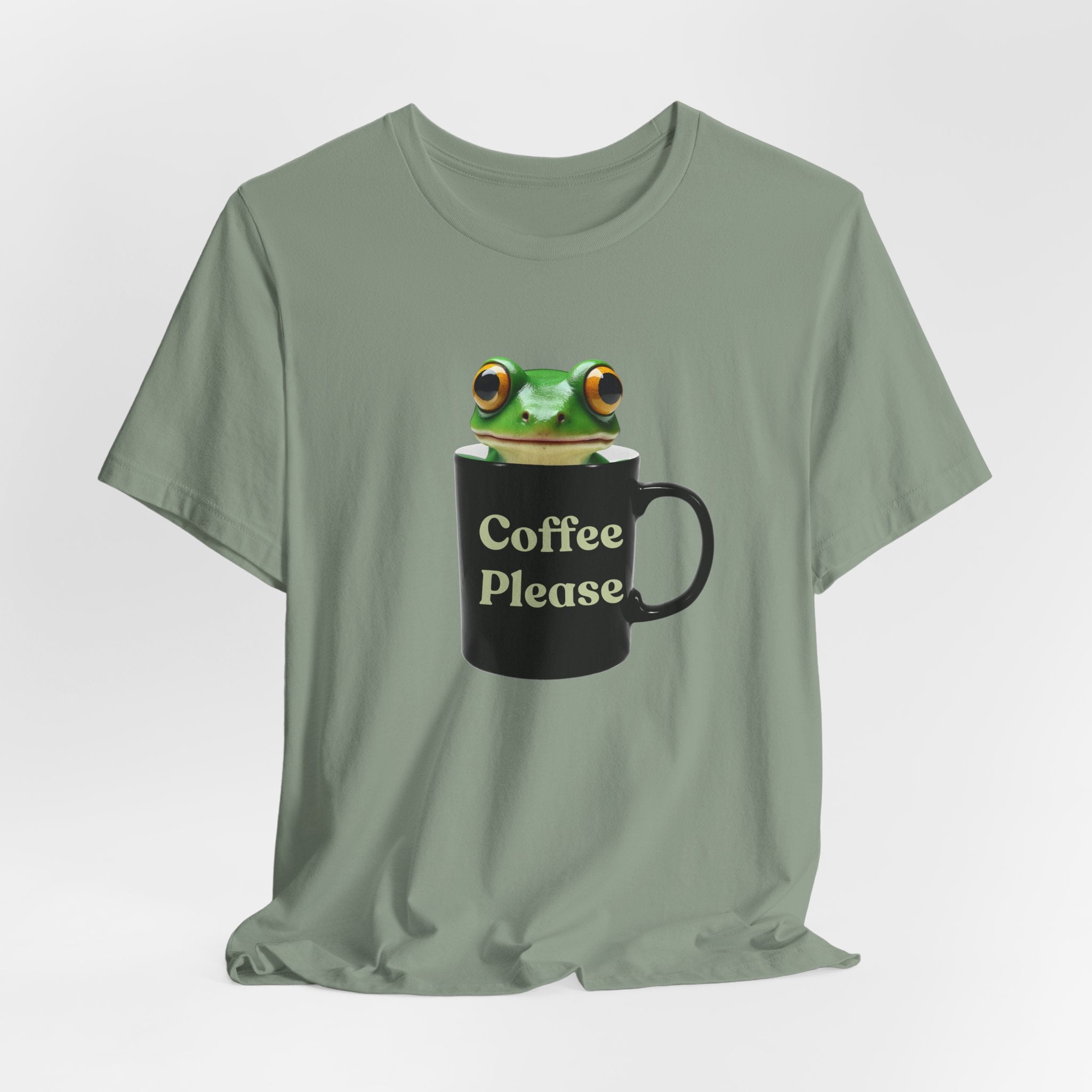Sage green t-shirt with a frog holding a mug labeled 'Coffee Please' on a light gray background