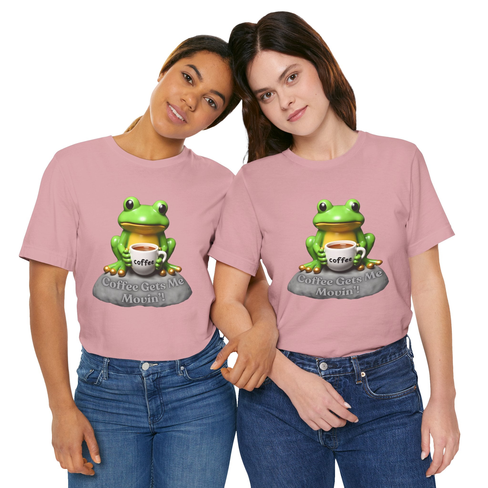 Two people wearing pink t-shirts with a frog graphic and 'Coffee Gets Me Moving' text.