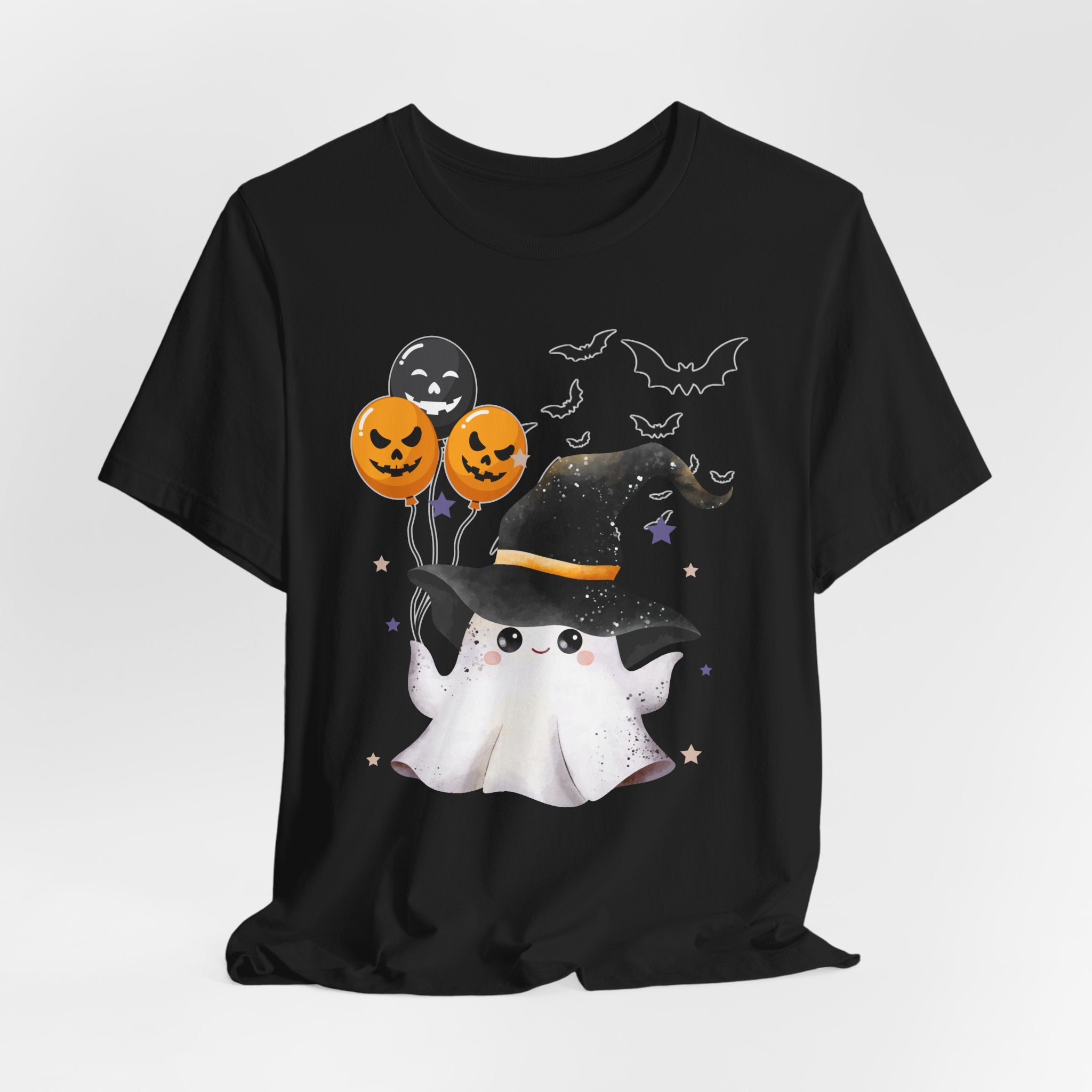 Black t-shirt with Halloween-themed design featuring a ghost, balloons, and bats on a white background.