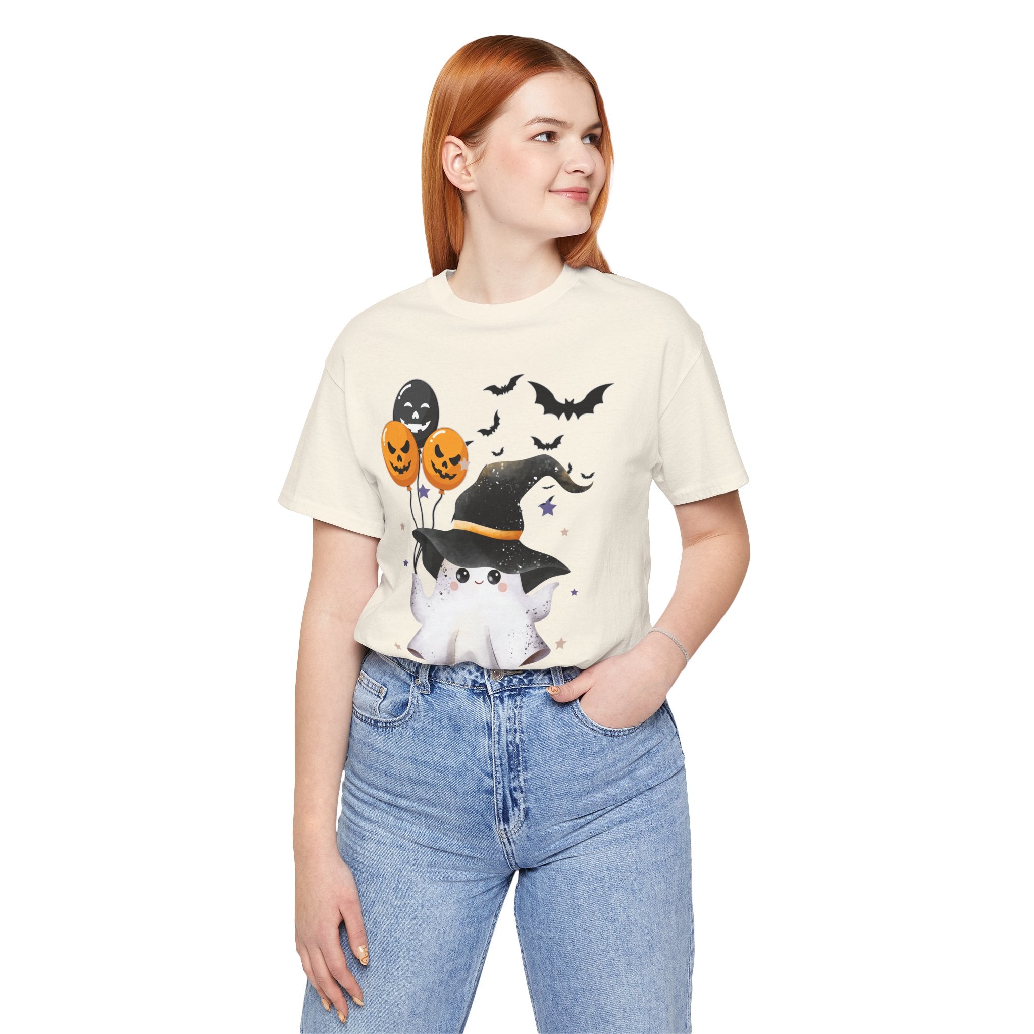 Person wearing a Halloween-themed t-shirt with graphics on a white background