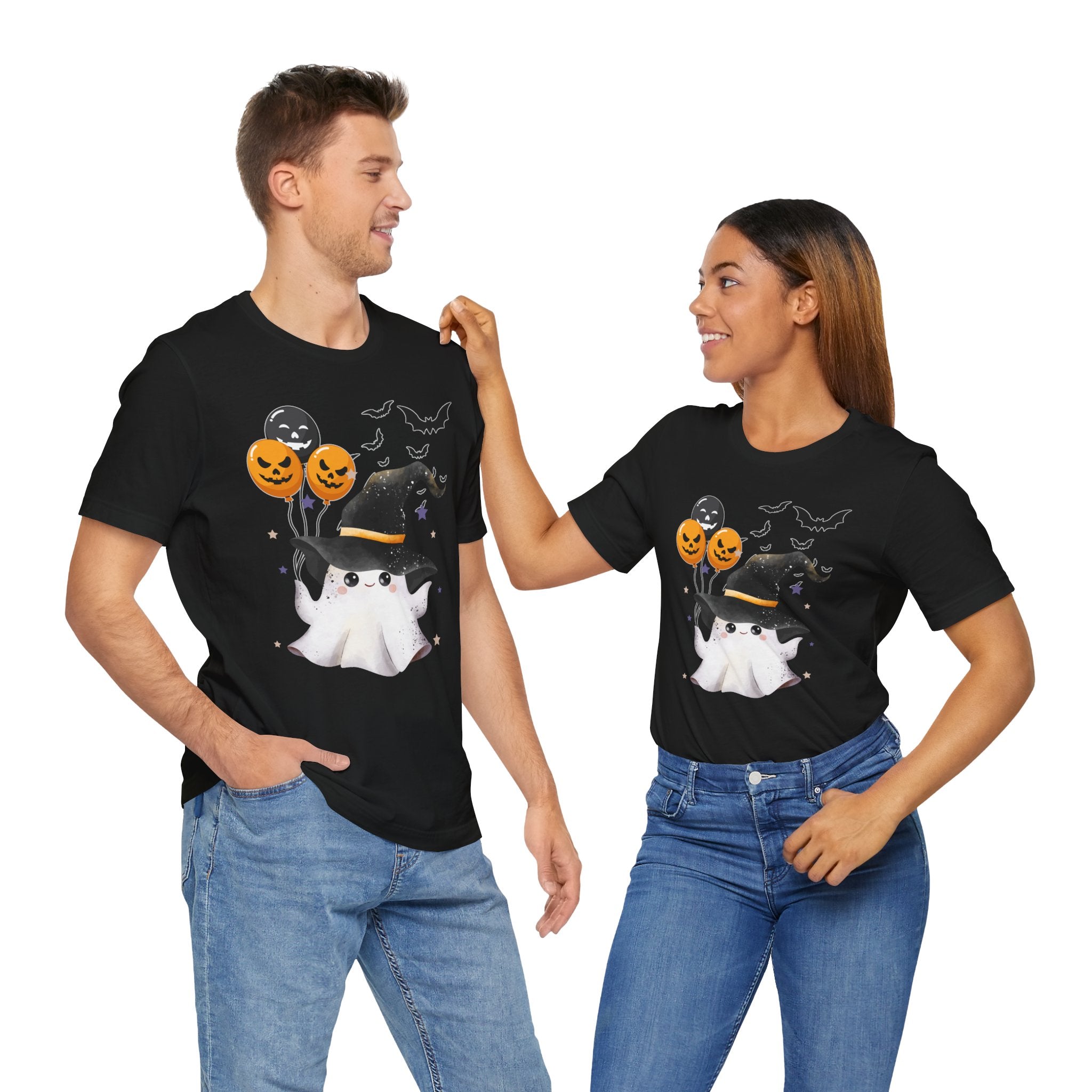 Two people wearing black t-shirts with Halloween-themed designs on a white background