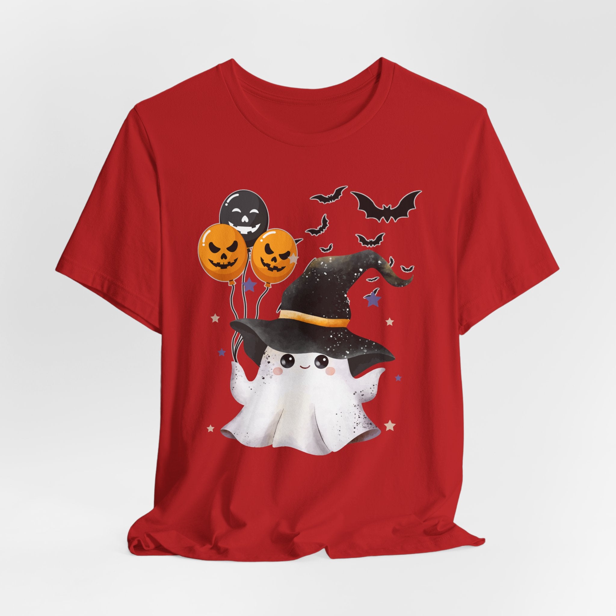 Red t-shirt with Halloween-themed design featuring a ghost, balloons, and bats on a white background.