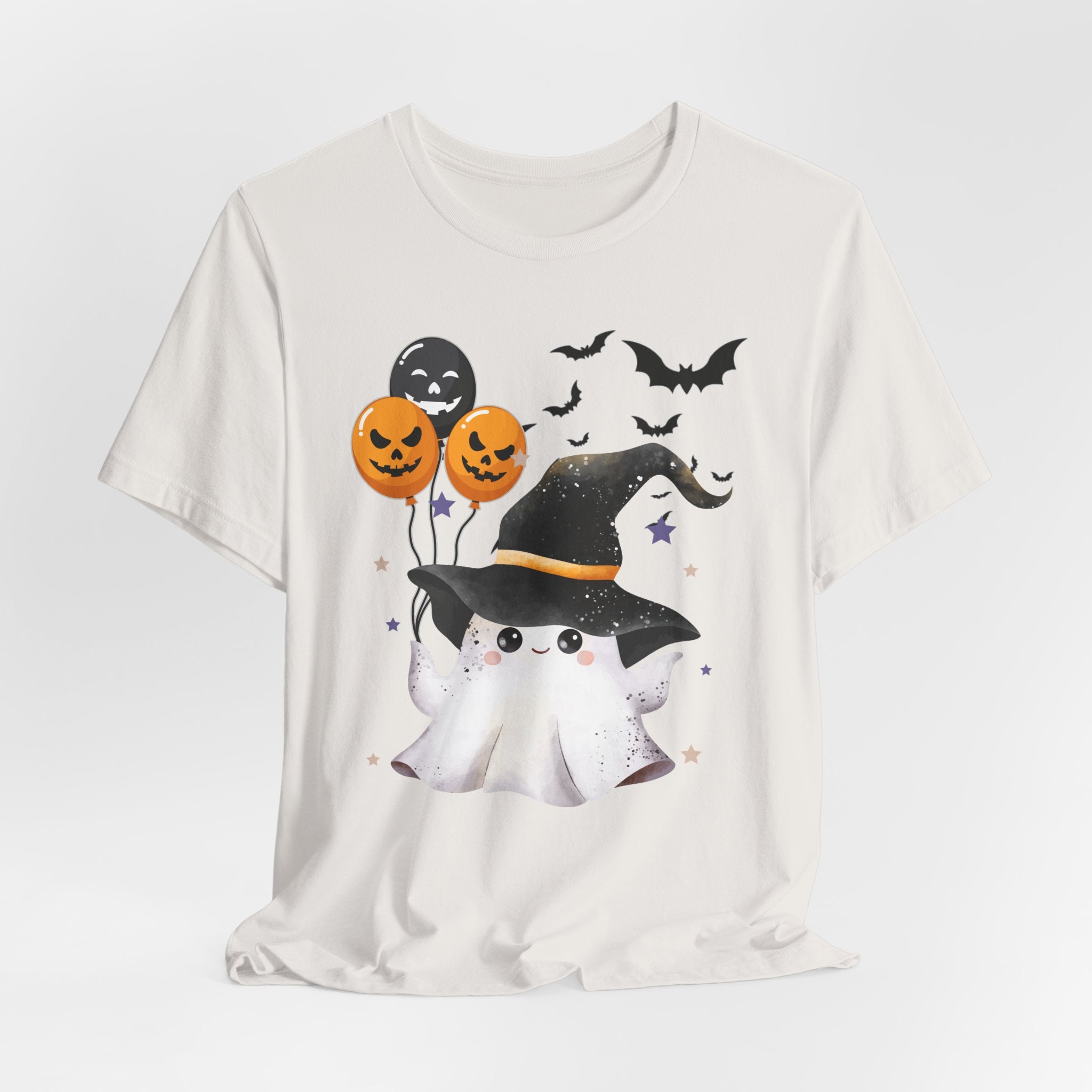 Vintage white t-shirt with Halloween-themed design featuring a ghost, pumpkins, and bats on a white background.