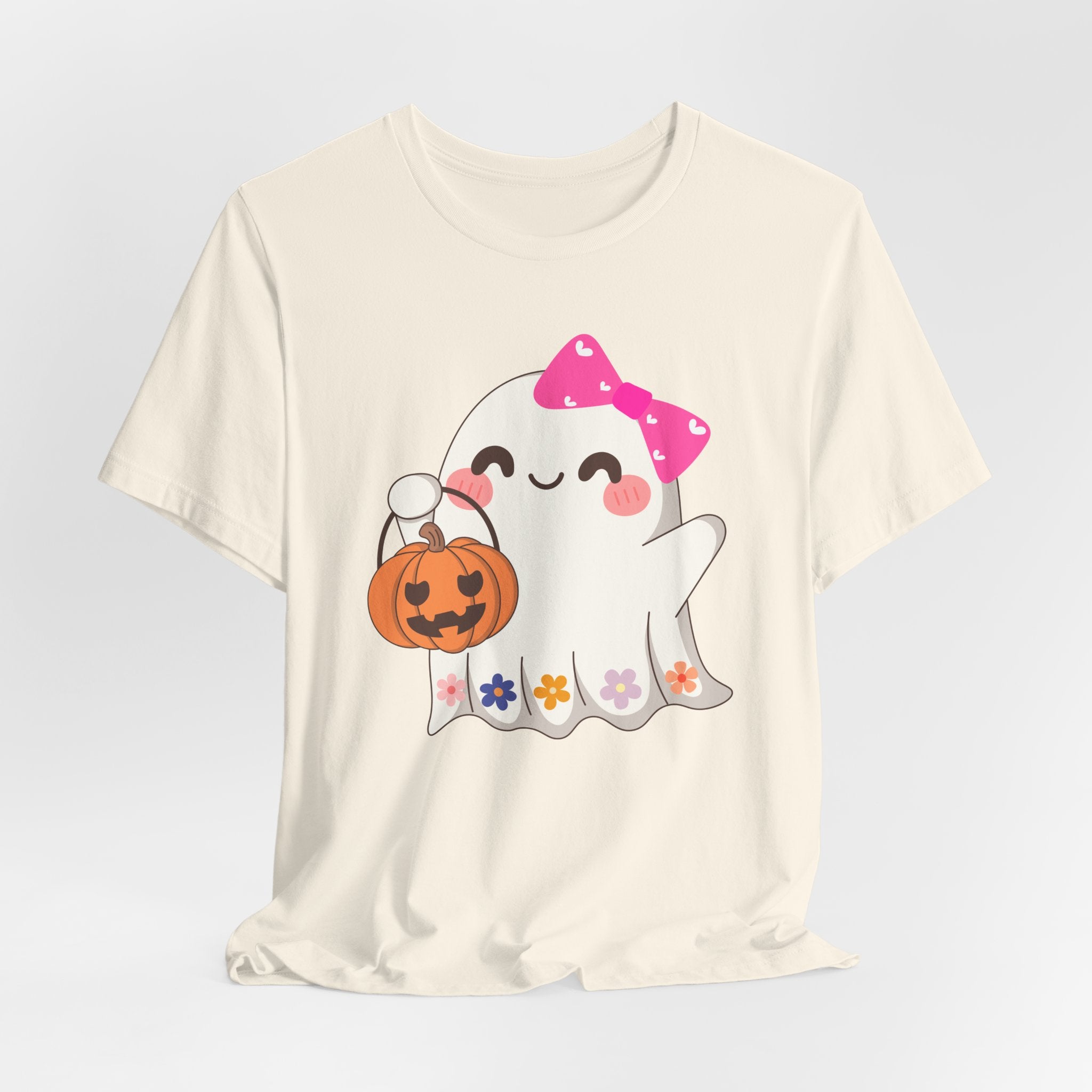 Ivory beige t-shirt with a cute Halloween ghost design holding a pumpkin on a white background
