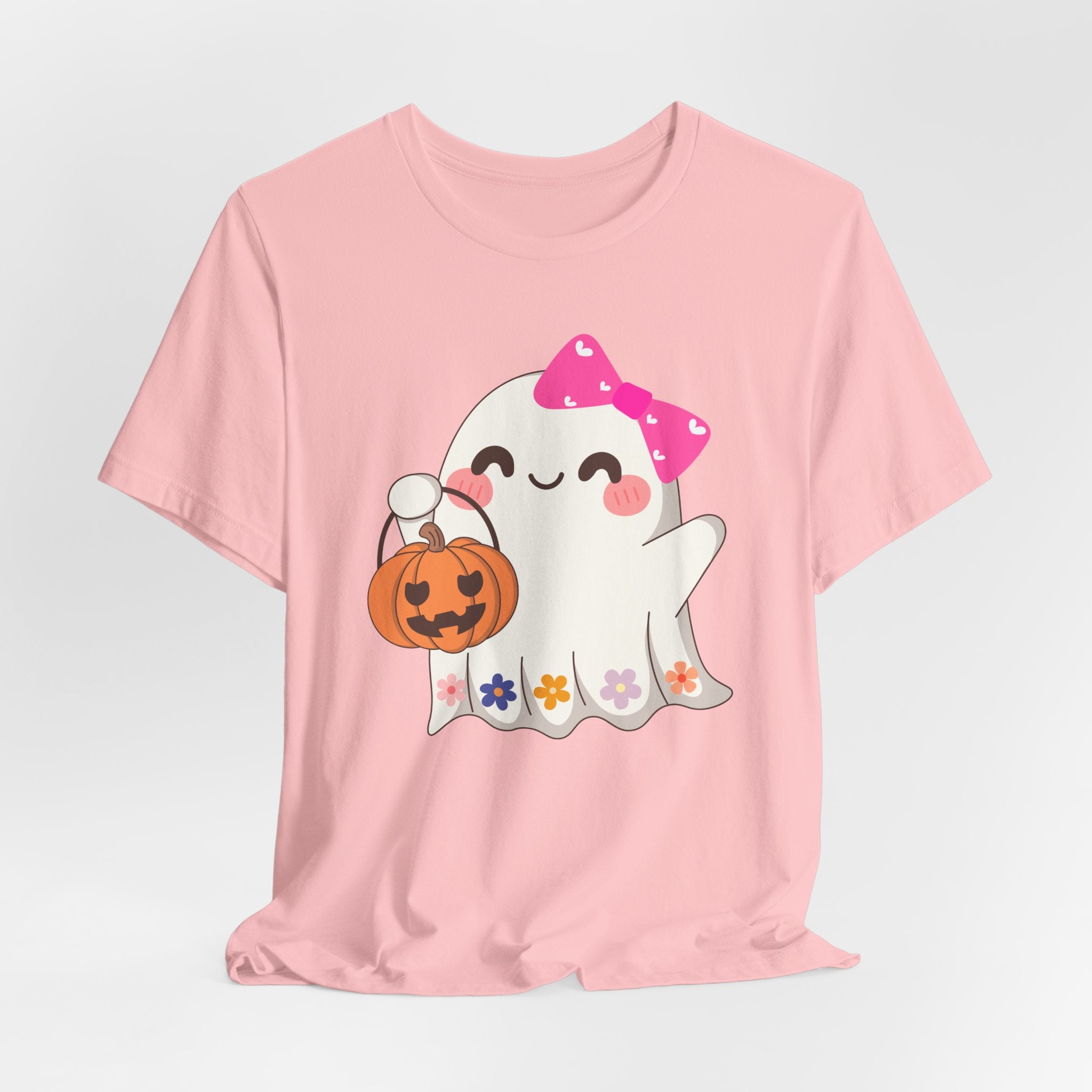 Pink t-shirt with a cute Halloween ghost design holding a pumpkin on a white background
