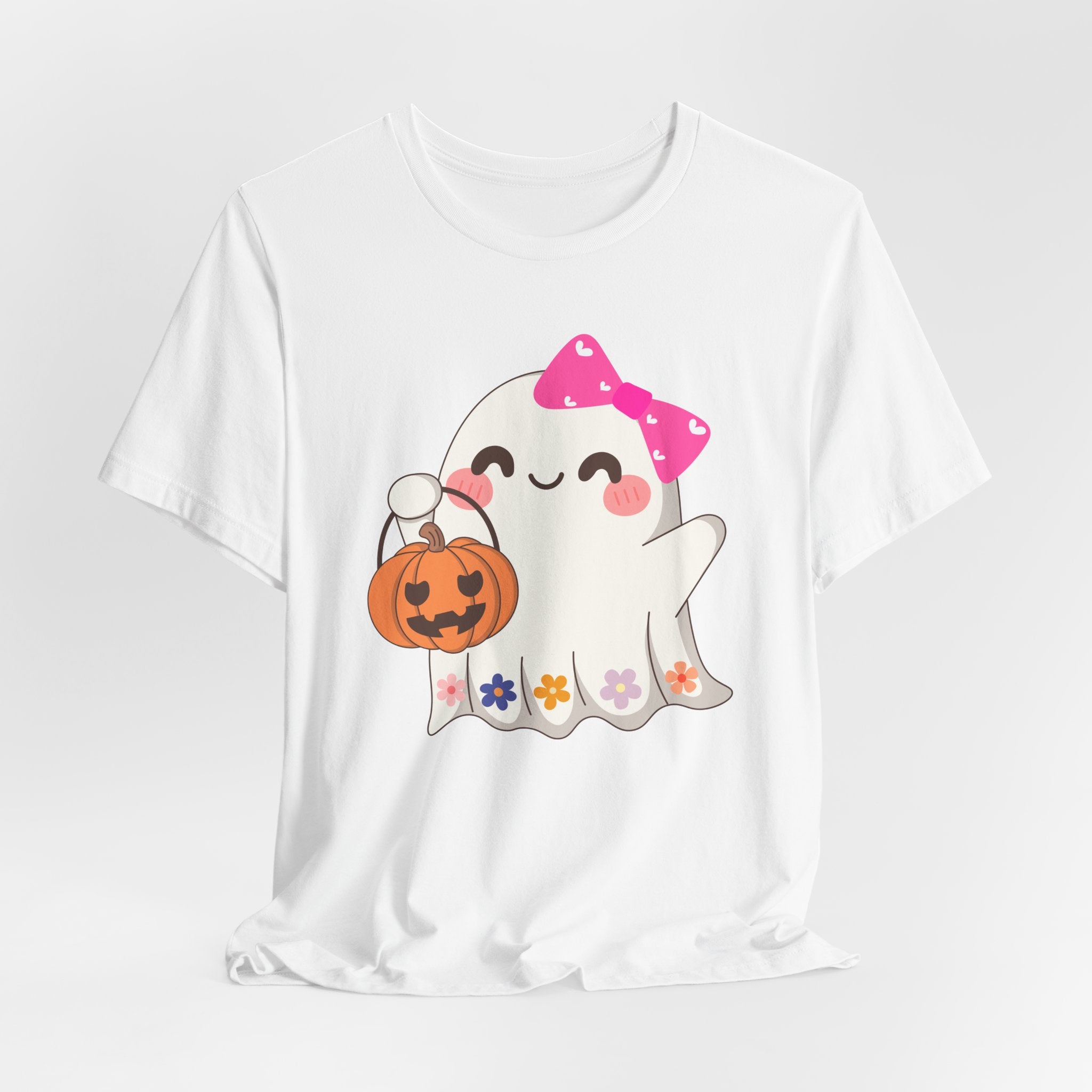 White t-shirt with a cute Halloween ghost design holding a pumpkin on a white background