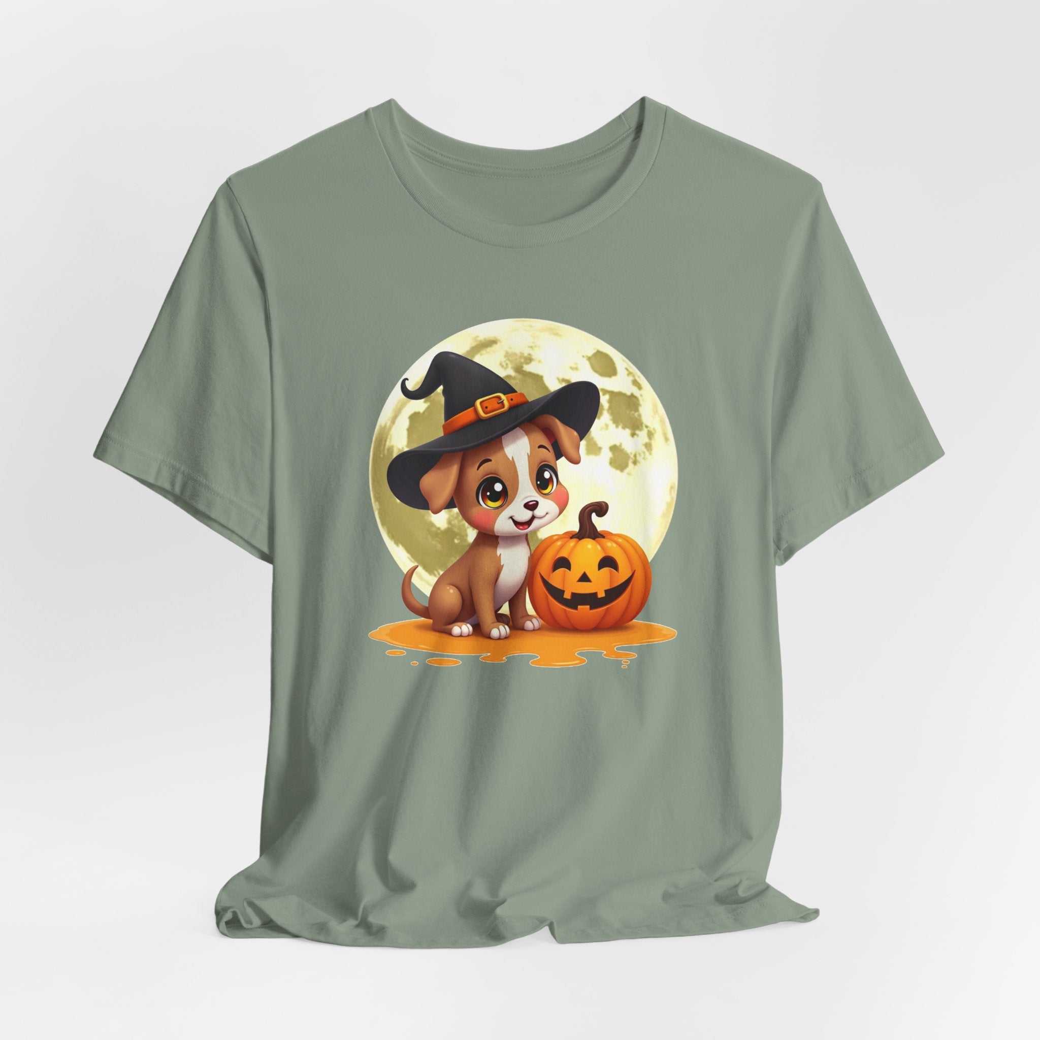 Sage green t-shirt with a Halloween-themed design of a dog in a witch hat and pumpkin.