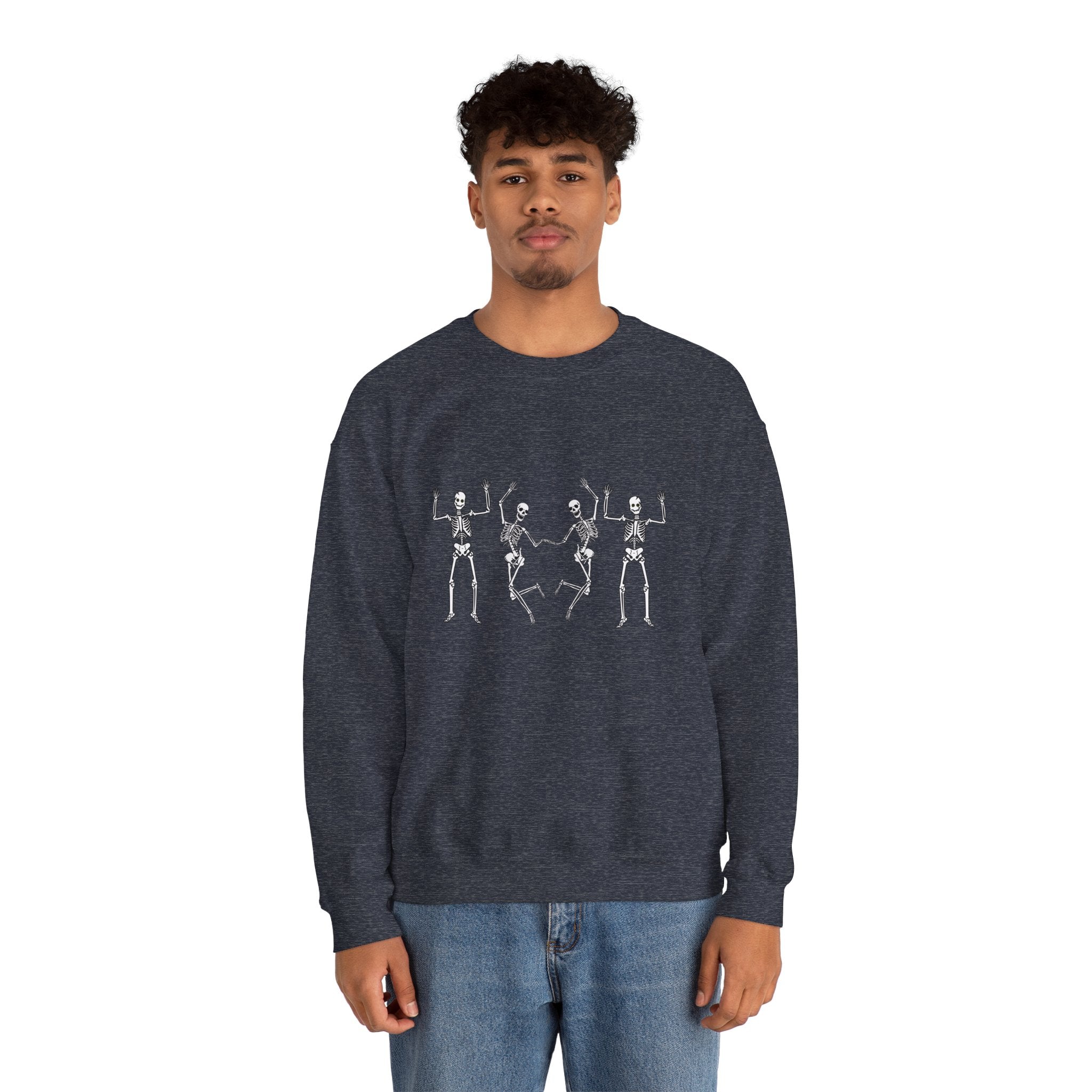 Person wearing a dark blue sweatshirt with skeleton designs on a white background