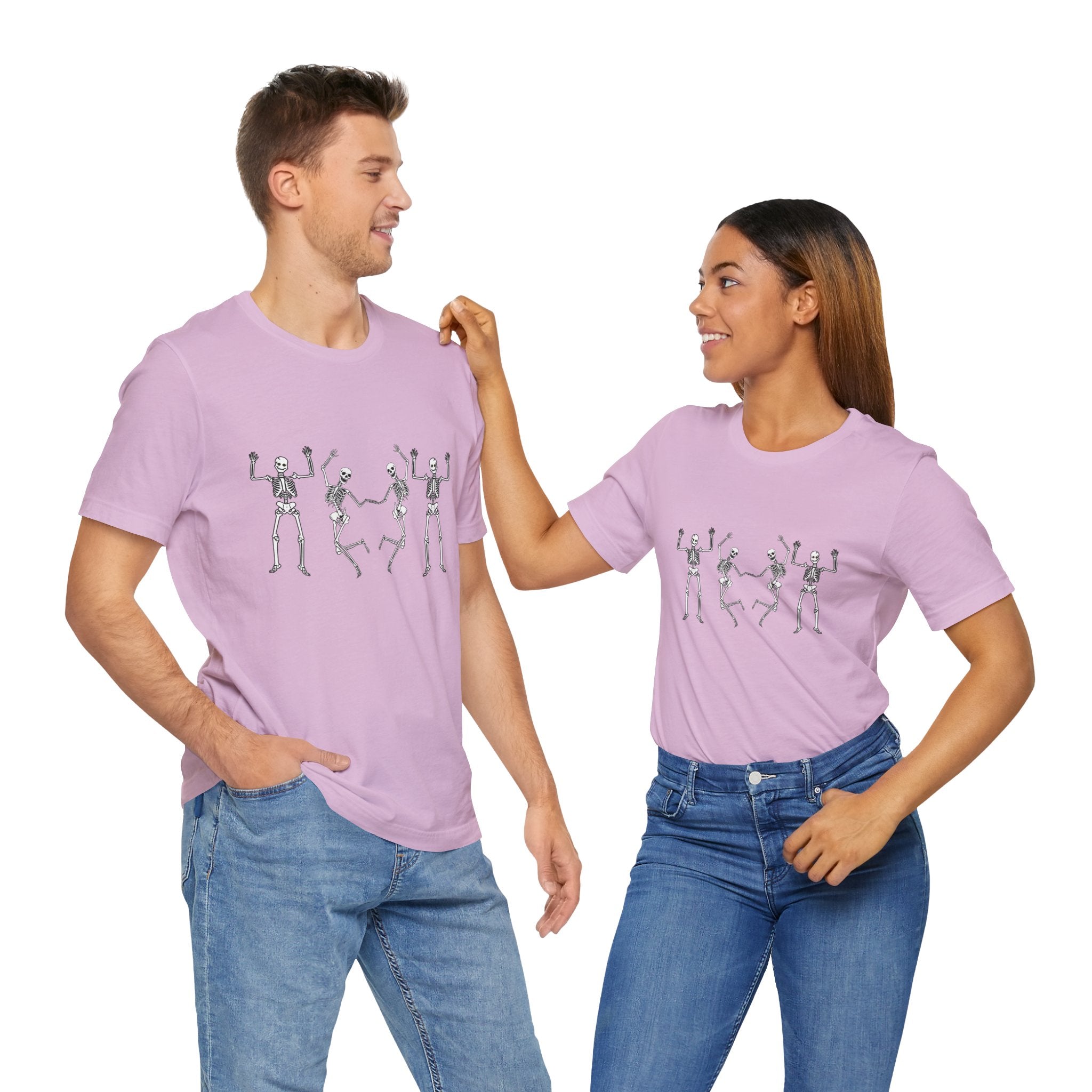 Two people wearing matching purple t-shirts with a skeleton design on a white background