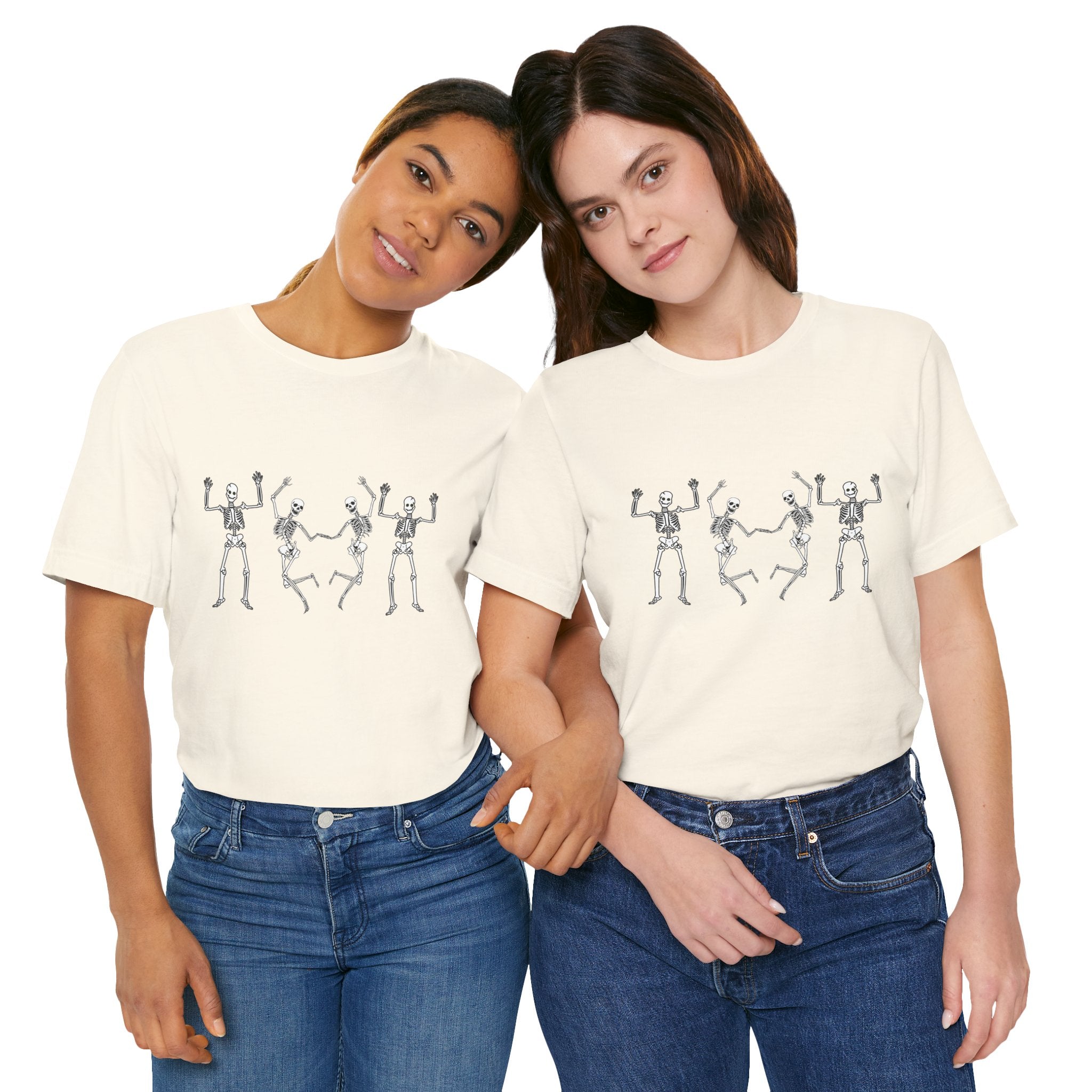 Two people wearing matching t-shirts with a skeleton design on a white background