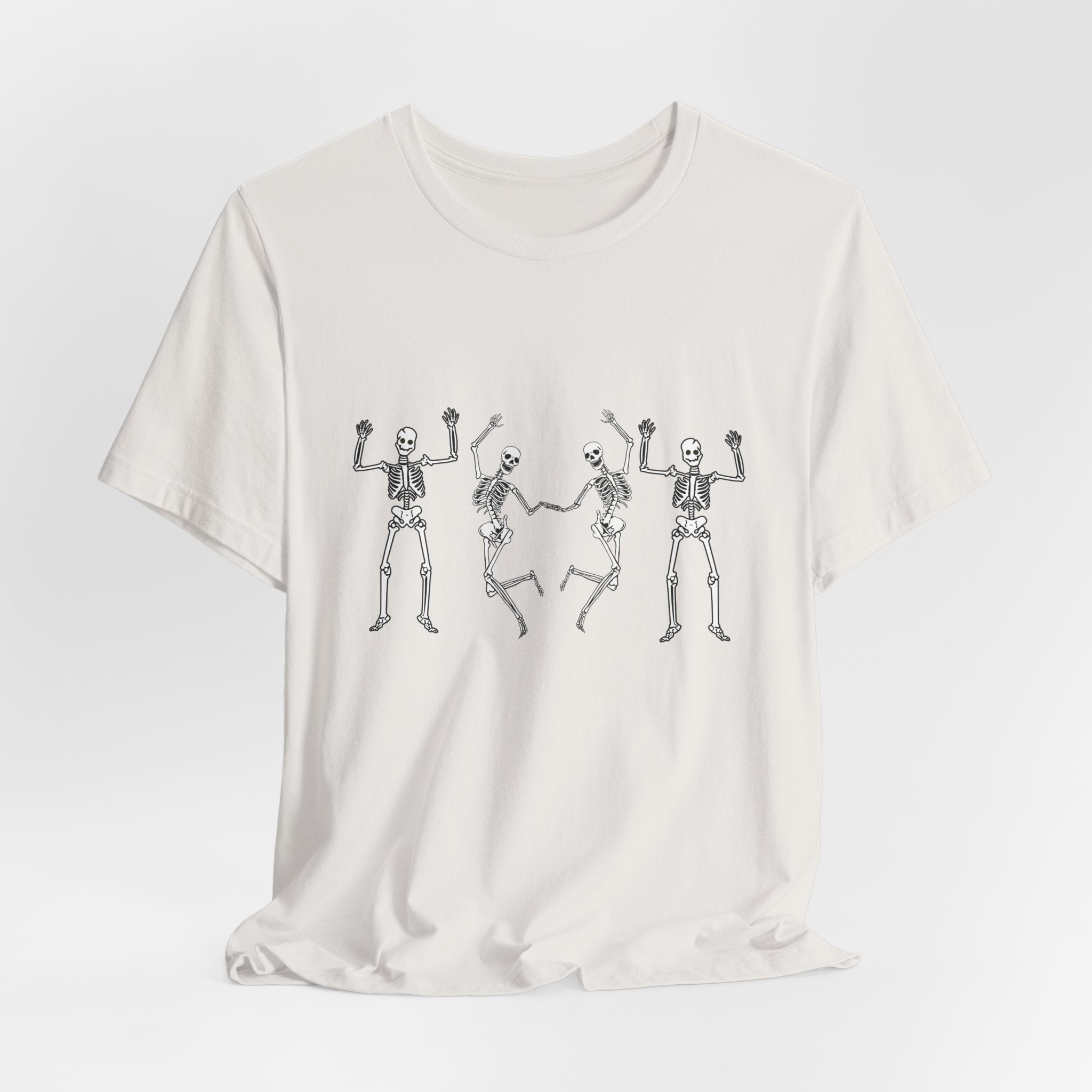 Vintage white t-shirt with skeleton designs on a light gray background