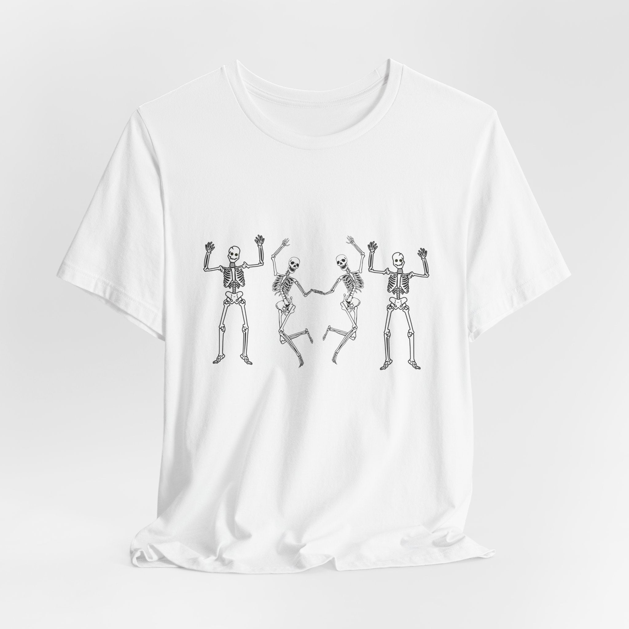 White t-shirt with black skeleton designs on a white background