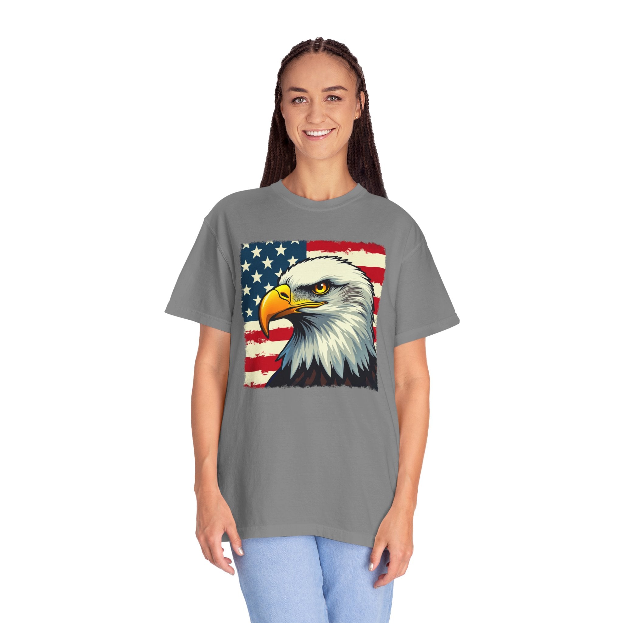 Person wearing a gray t-shirt with an eagle and American flag design on a white background