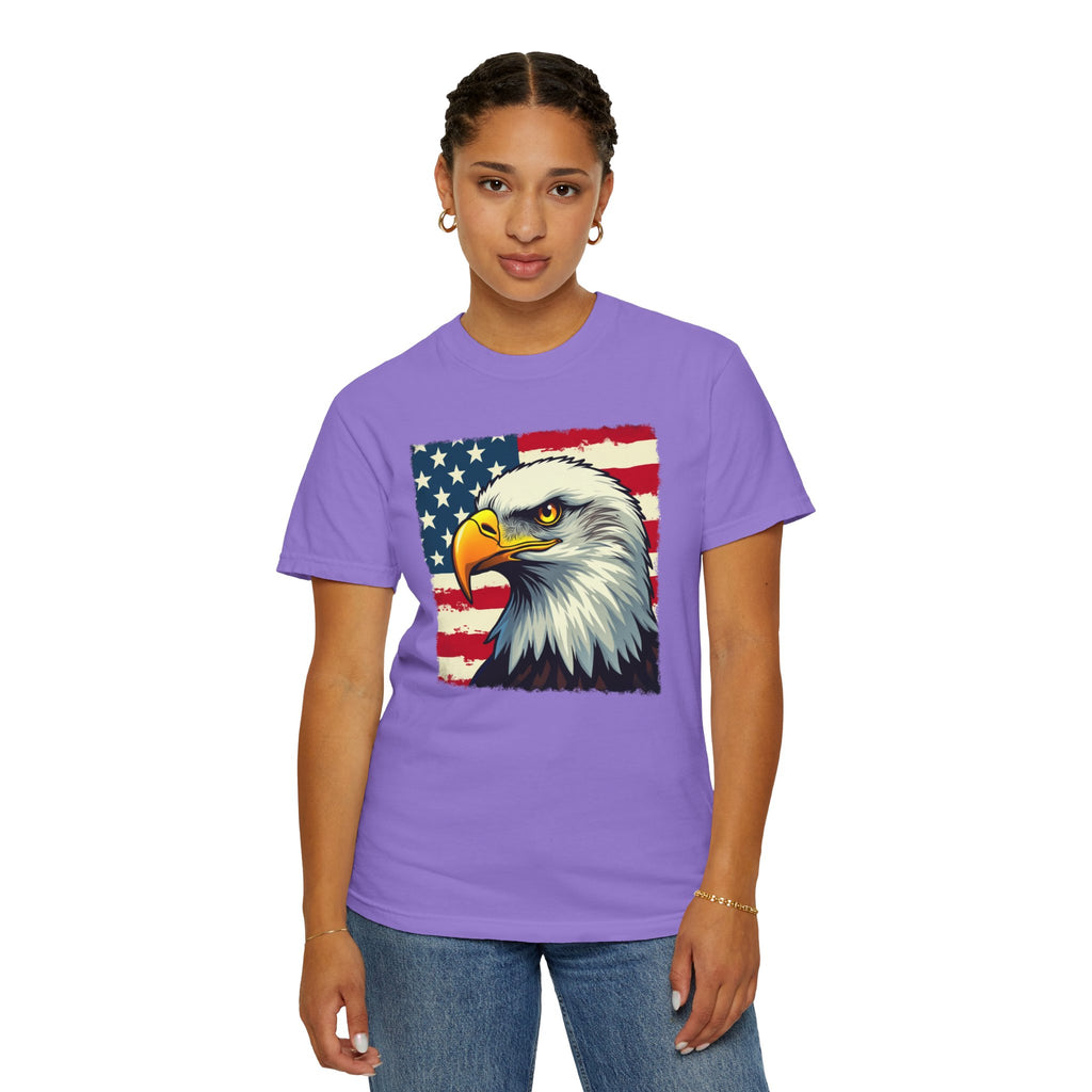Person wearing a purple t-shirt with an eagle and American flag design on a white background