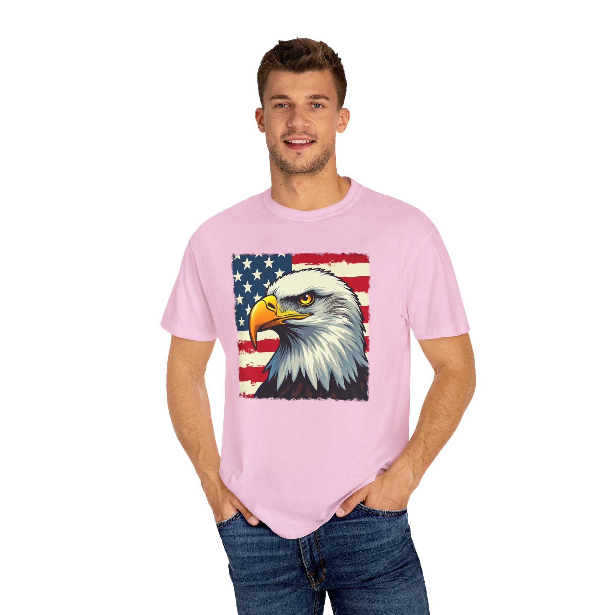 Man wearing a pink t-shirt with an eagle and American flag design on a white background