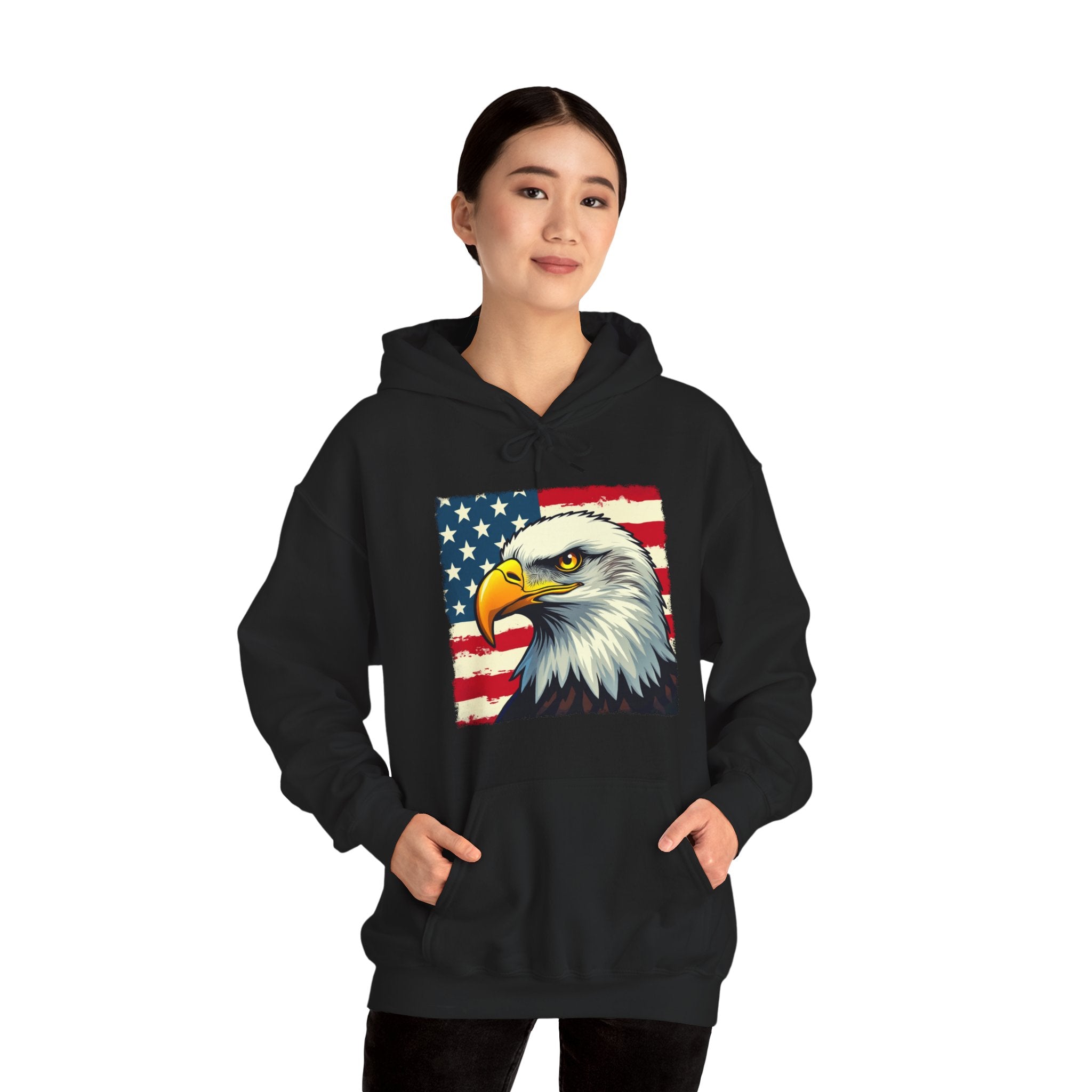 Person wearing a black hoodie with an eagle and American flag design on a white background