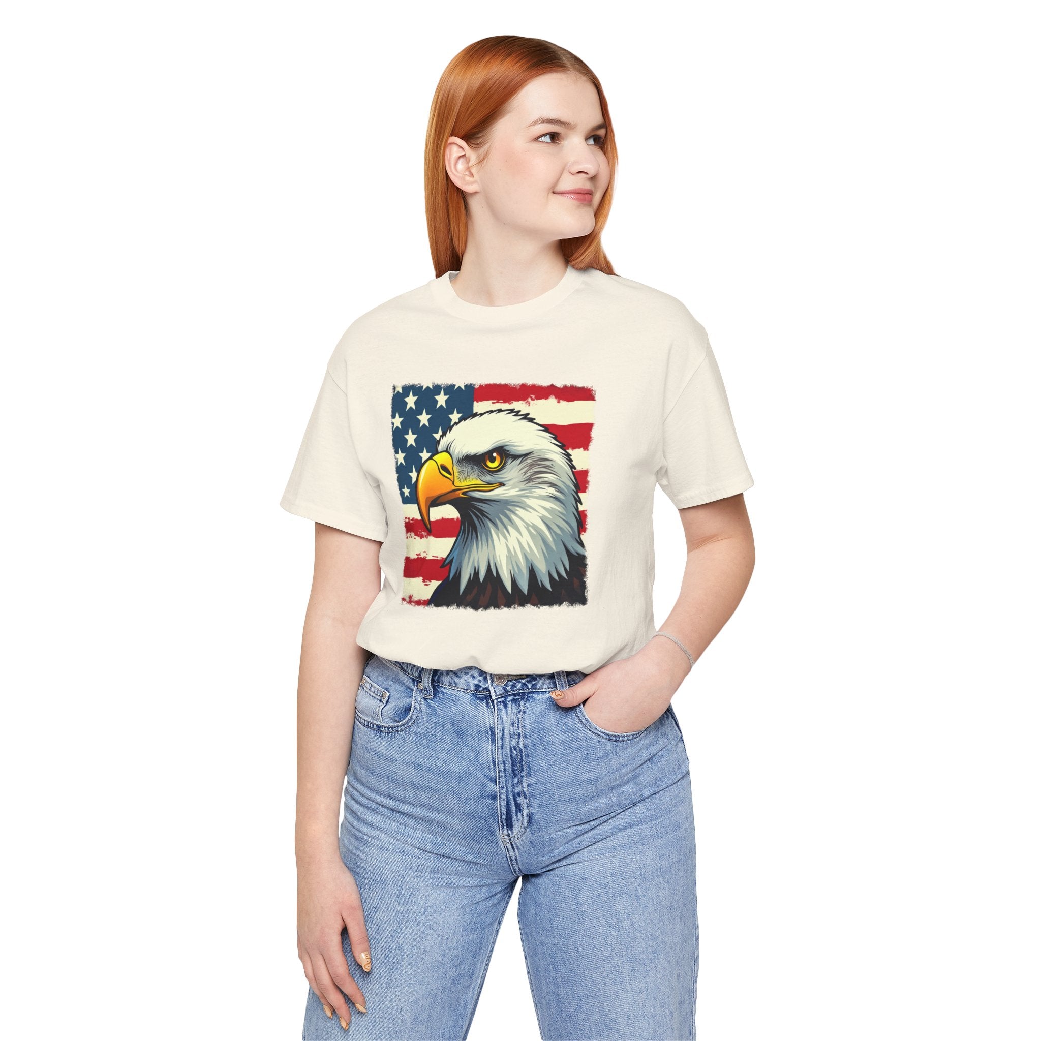 Person wearing a t-shirt with an eagle and American flag design on a white background