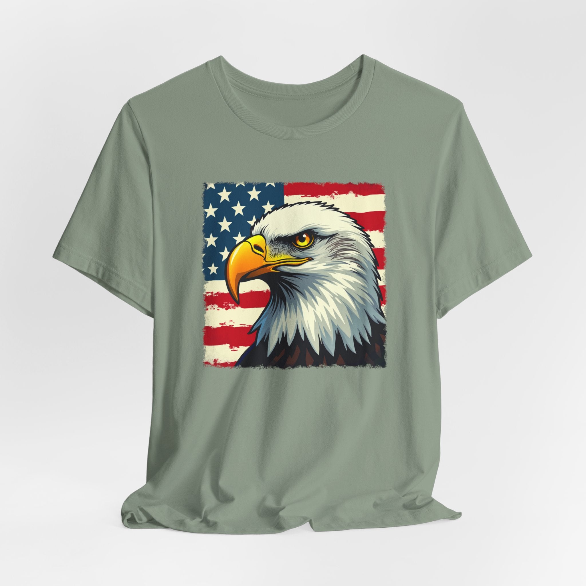 Sage green t-shirt with an eagle and American flag design on a light gray background