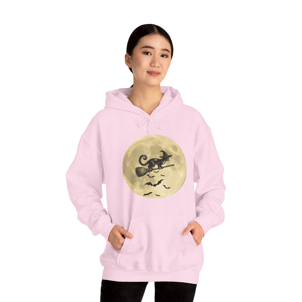 Person wearing a pink hoodie with a graphic design on a white background
